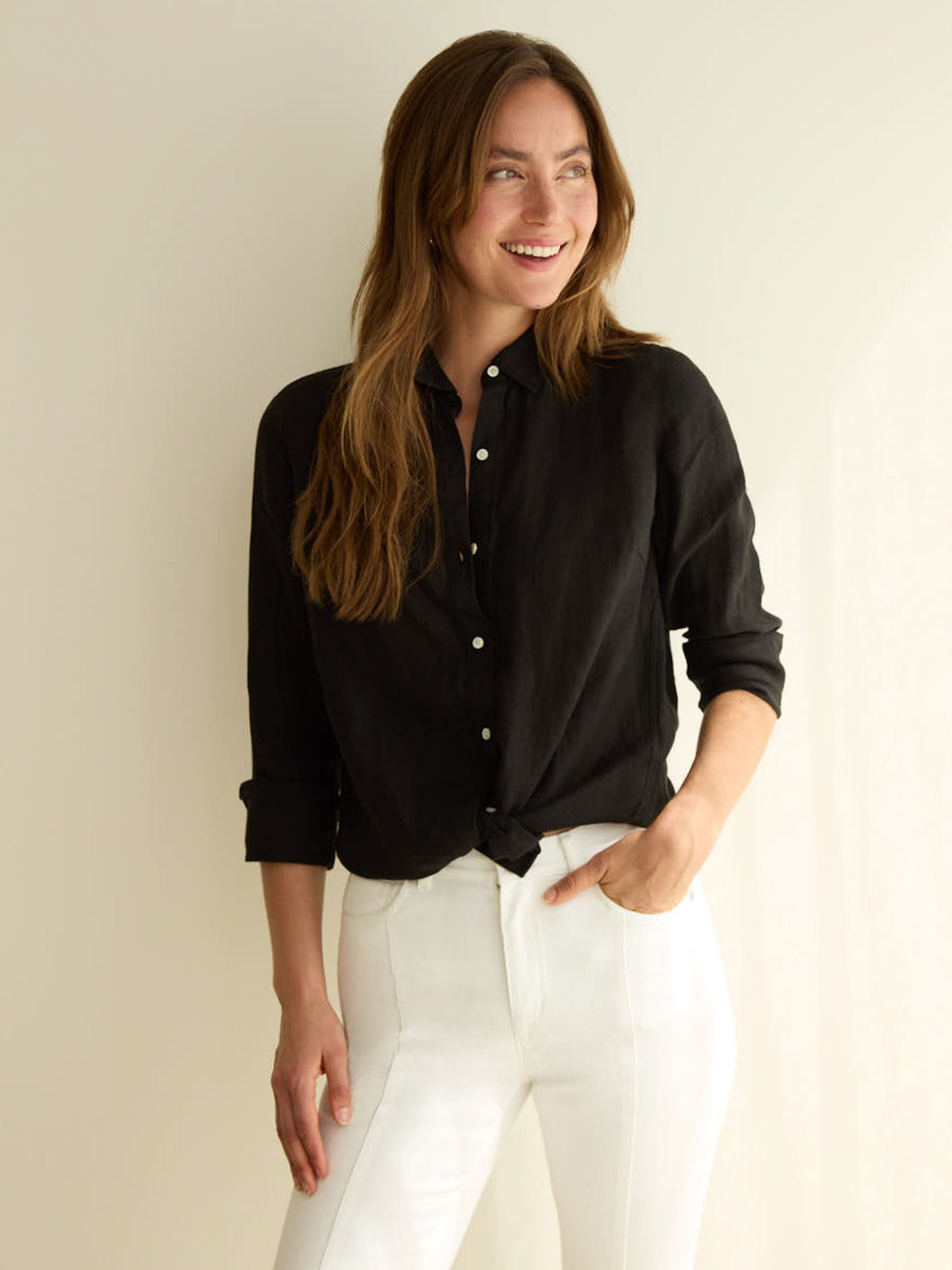 Model wearing J.McLaughlin Britt shirt in black made with linen.