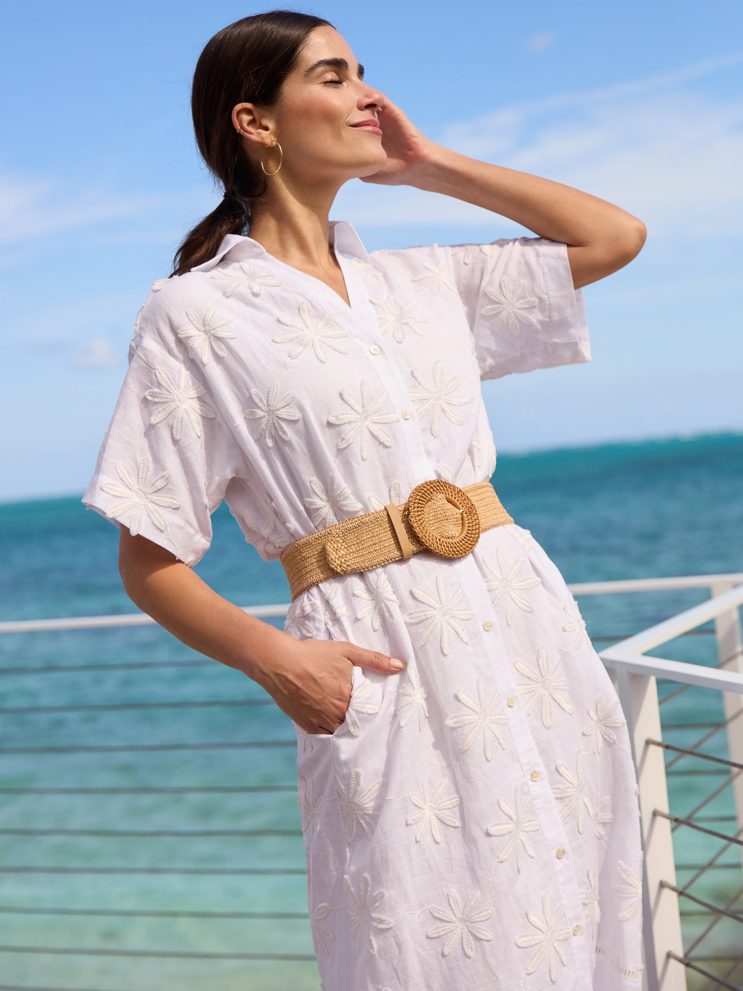Model wearing J.McLaughlin Anamaria dress in white made with linen and cotton.