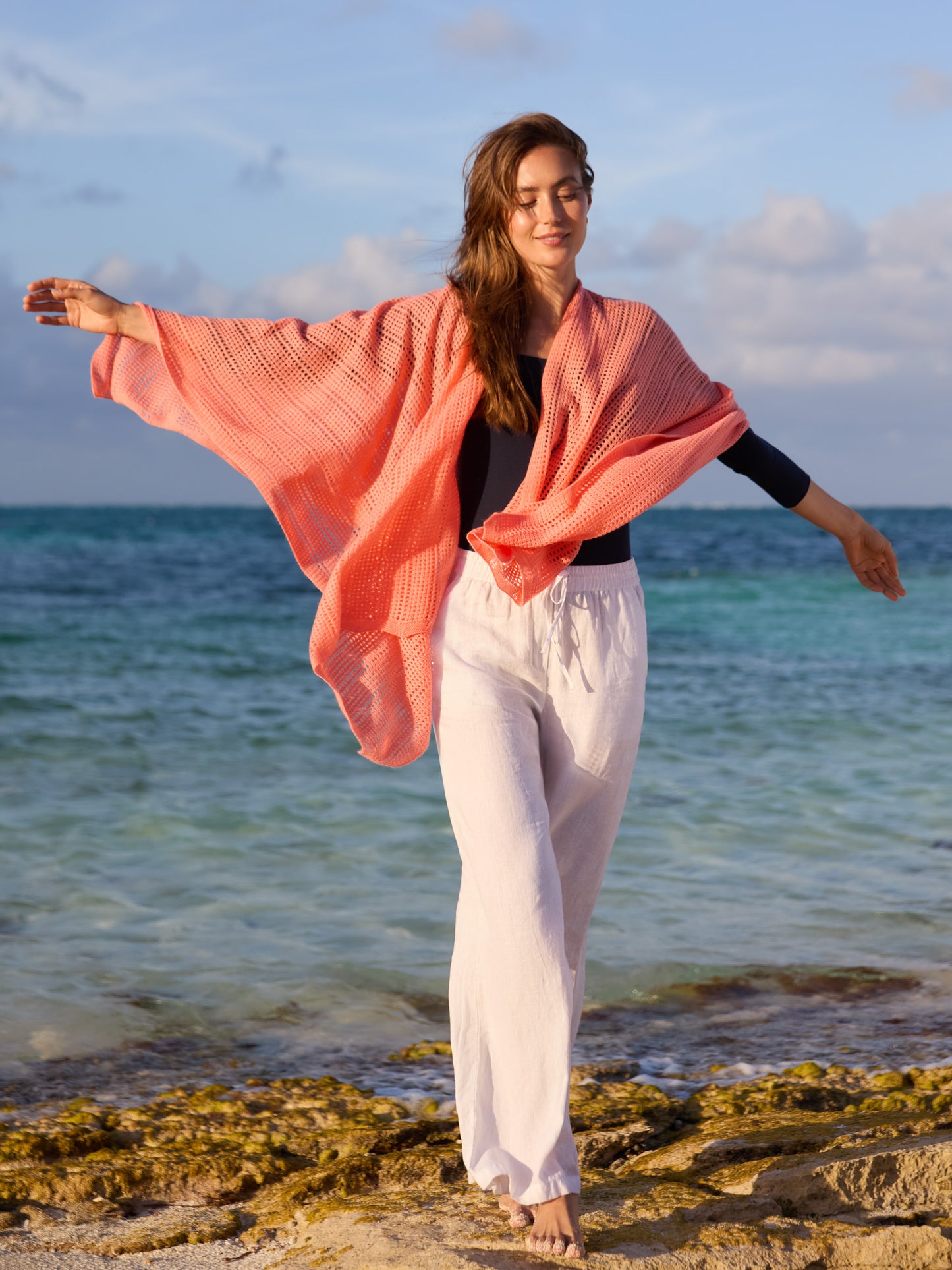 J.McLaughlin model wears Paola Cashmere Wrap in Papaya made with Cashmere.