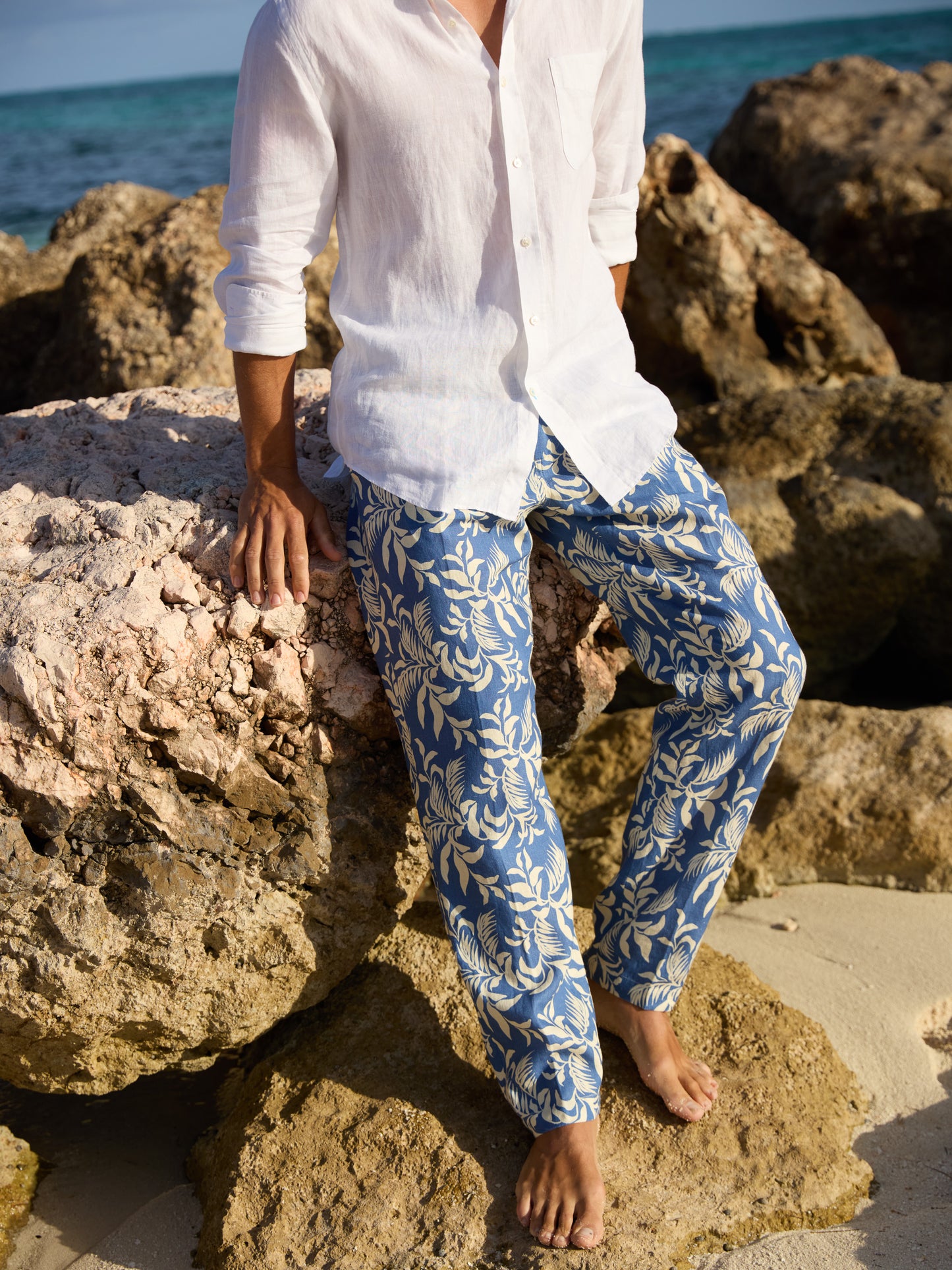 Model wearing J.McLaughlin Callister pants in medium blue/off white made with linen.