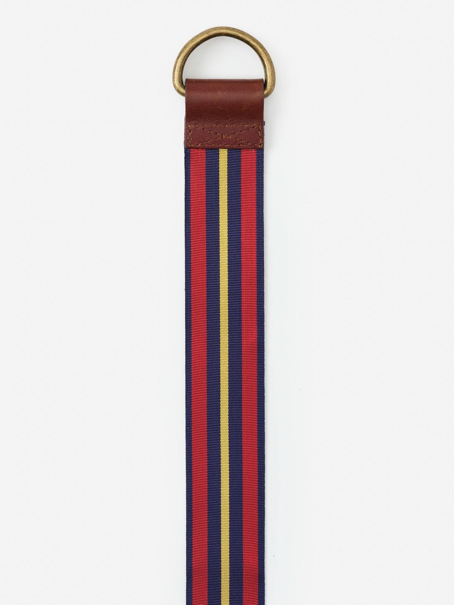 Ribbon Belt in Stripe by J.McLaughlin features an effortlessly stylish striped fabric with a leather accent and brass ring, combining enduring designs and a legacy of timeless fashion.