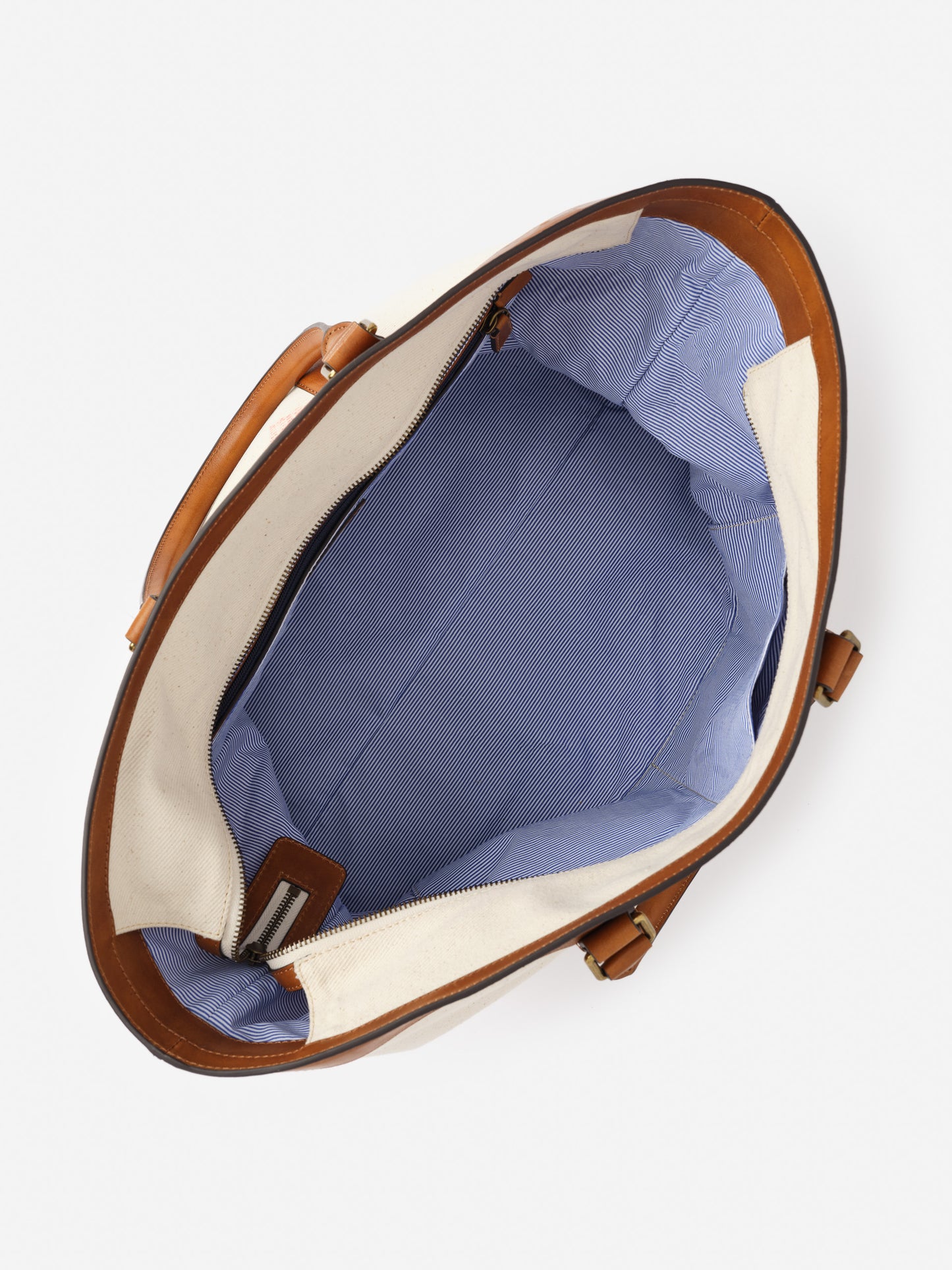 Open Wells Canvas Tote by J.McLaughlin showcasing a spacious, striped interior with leather trim, reflecting effortlessly stylish, enduring designs and a legacy of timeless fashion.