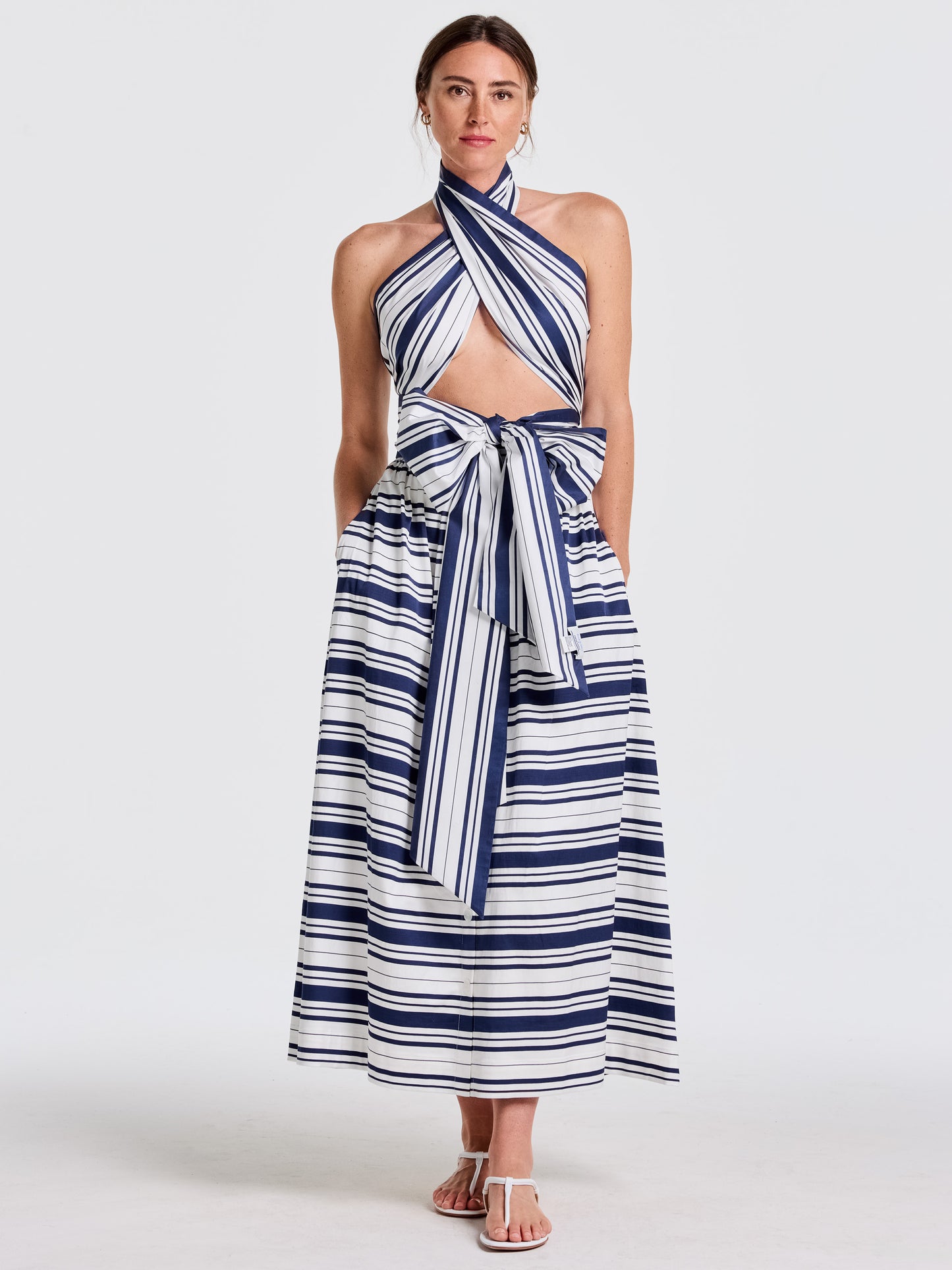 Woman wearing a stylish Mariner Stripe outfit featuring the Donna Scarf in Mariner Stripe by J.McLaughlin, showcasing effortlessly stylish, enduring designs and innovative fabrics for a legacy of timeless fashion. A destination for defining style. Life, Well-Lived.