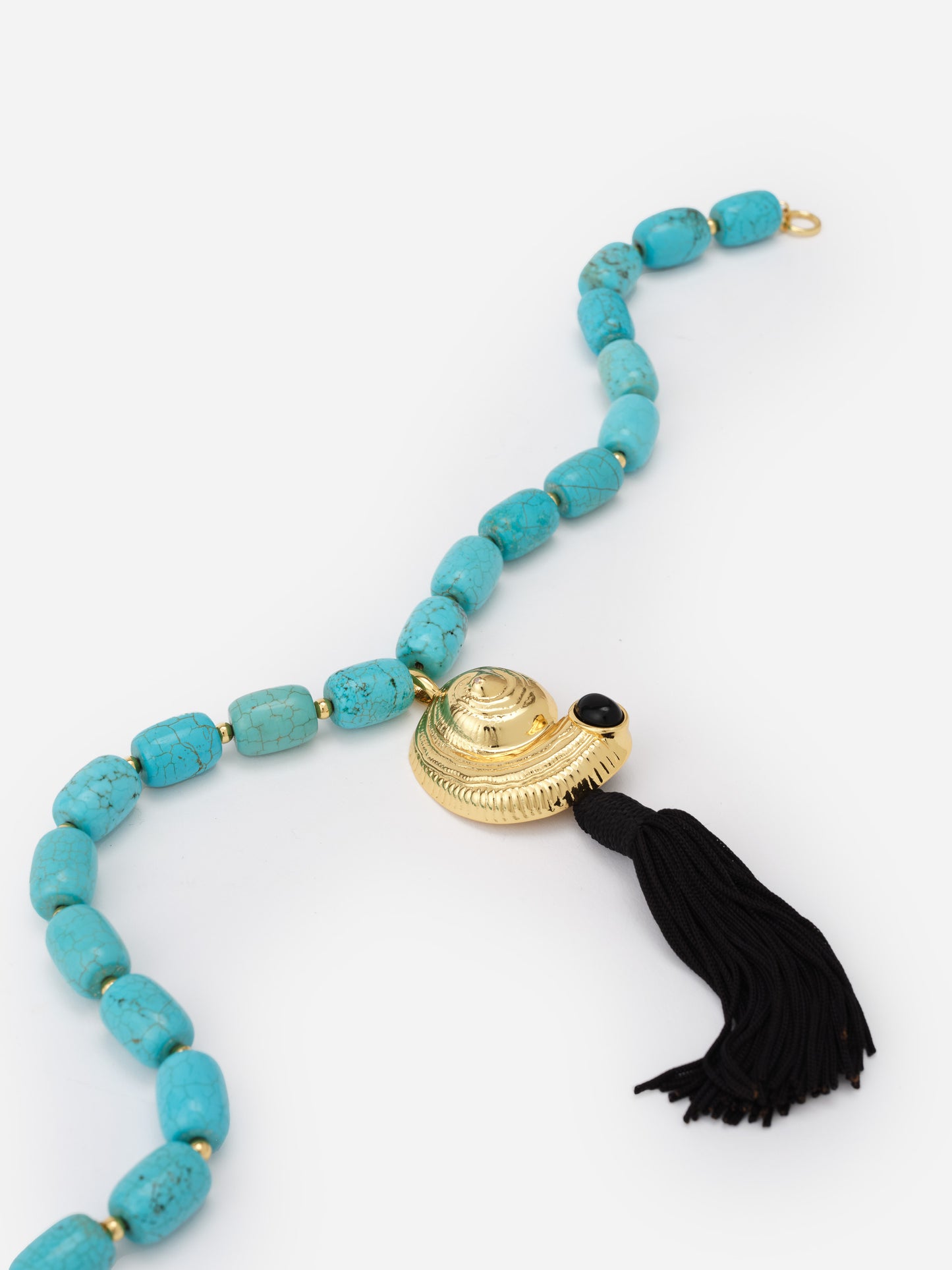 Shell Tassel Necklace by J.McLaughlin featuring turquoise beads with a gold shell pendant and a black tassel, combining effortless style with enduring design.
