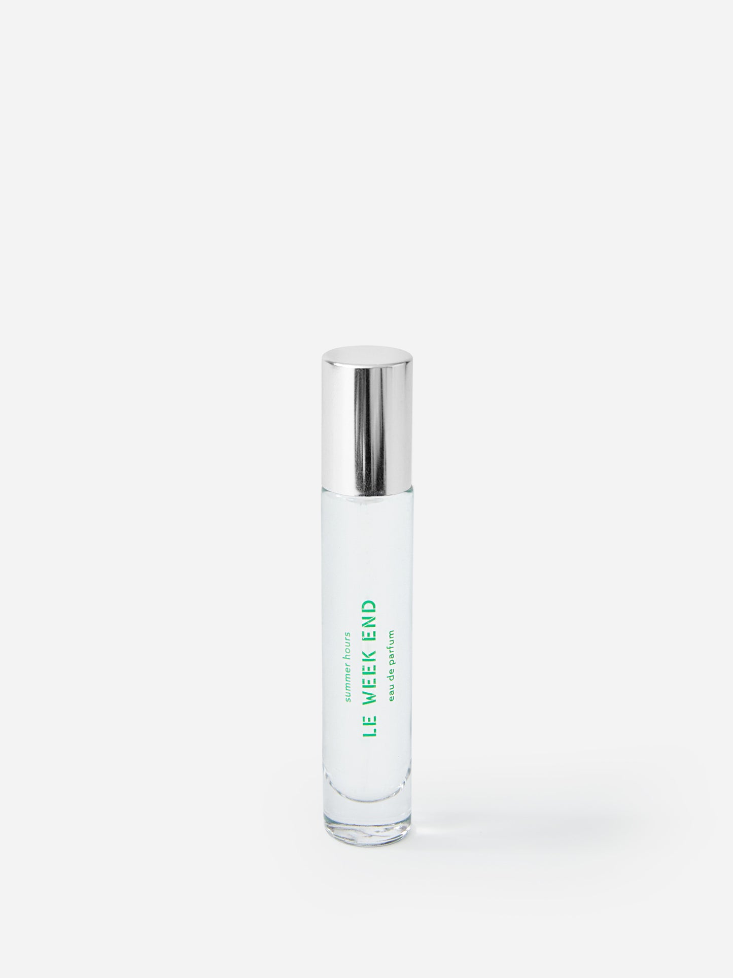 J.McL x Summer Hours Le Week End 15 mL Fragrance in green made with alcohol and water.