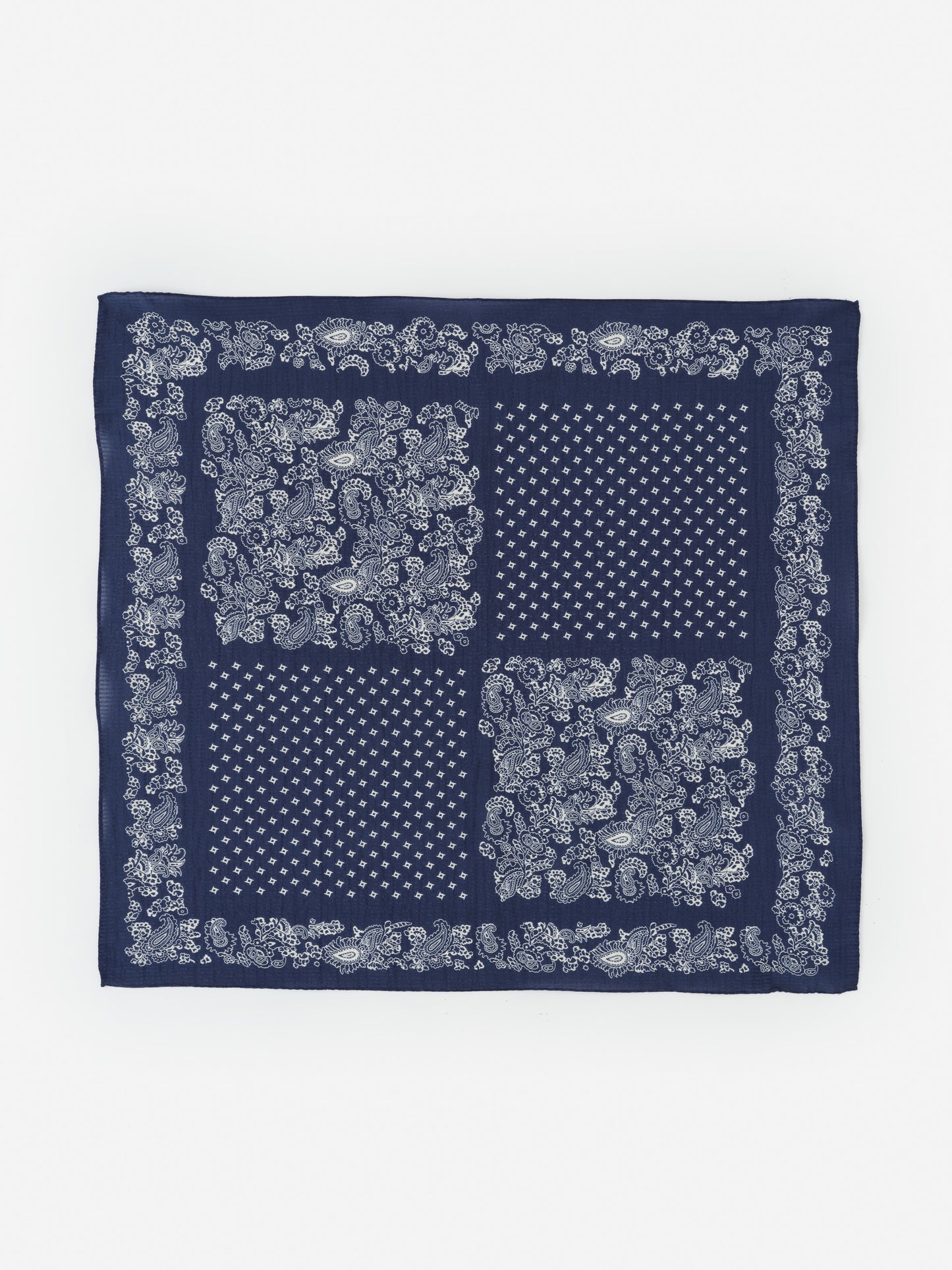 Seersucker Bandana in Riverside by J.McLaughlin features a classic navy blue design with intricate white paisley and geometric patterns, perfect for adding timeless style to any outfit.