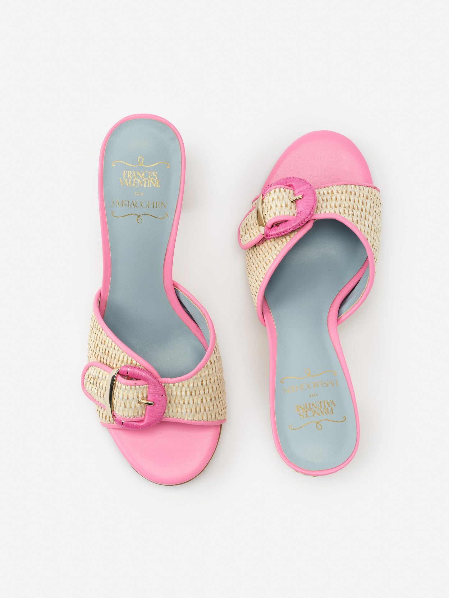 Taylor Heels by J.McLaughlin feature a chic woven design with pink trim and buckle accents, combining effortlessly stylish and enduring designs with a legacy of timeless fashion.