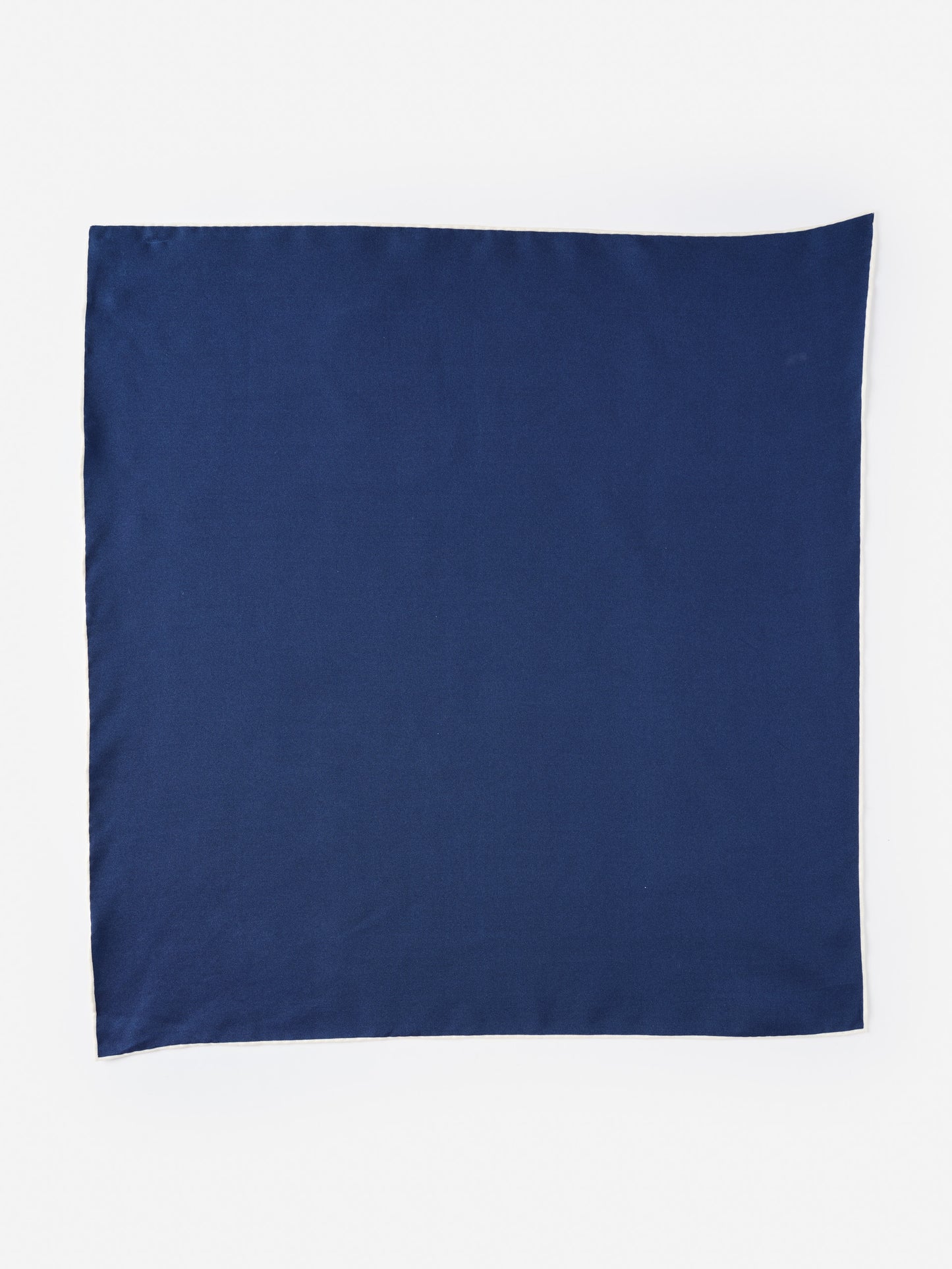 Smooth navy blue Xani Silk Scarf by J.McLaughlin, crafted with innovative fabrics for enduring designs that embody effortlessly stylish, timeless fashion.