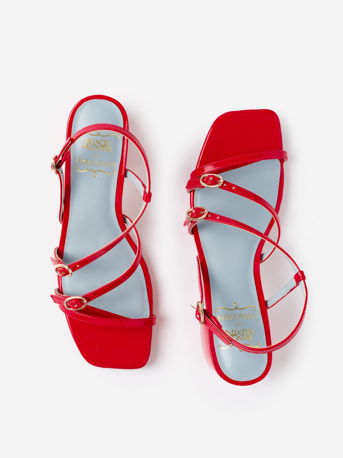 Red Lexi Heels by J.McLaughlin featuring multiple slim straps with gold buckles and a square toe design, showcasing effortlessly stylish, enduring designs with a legacy of timeless fashion.