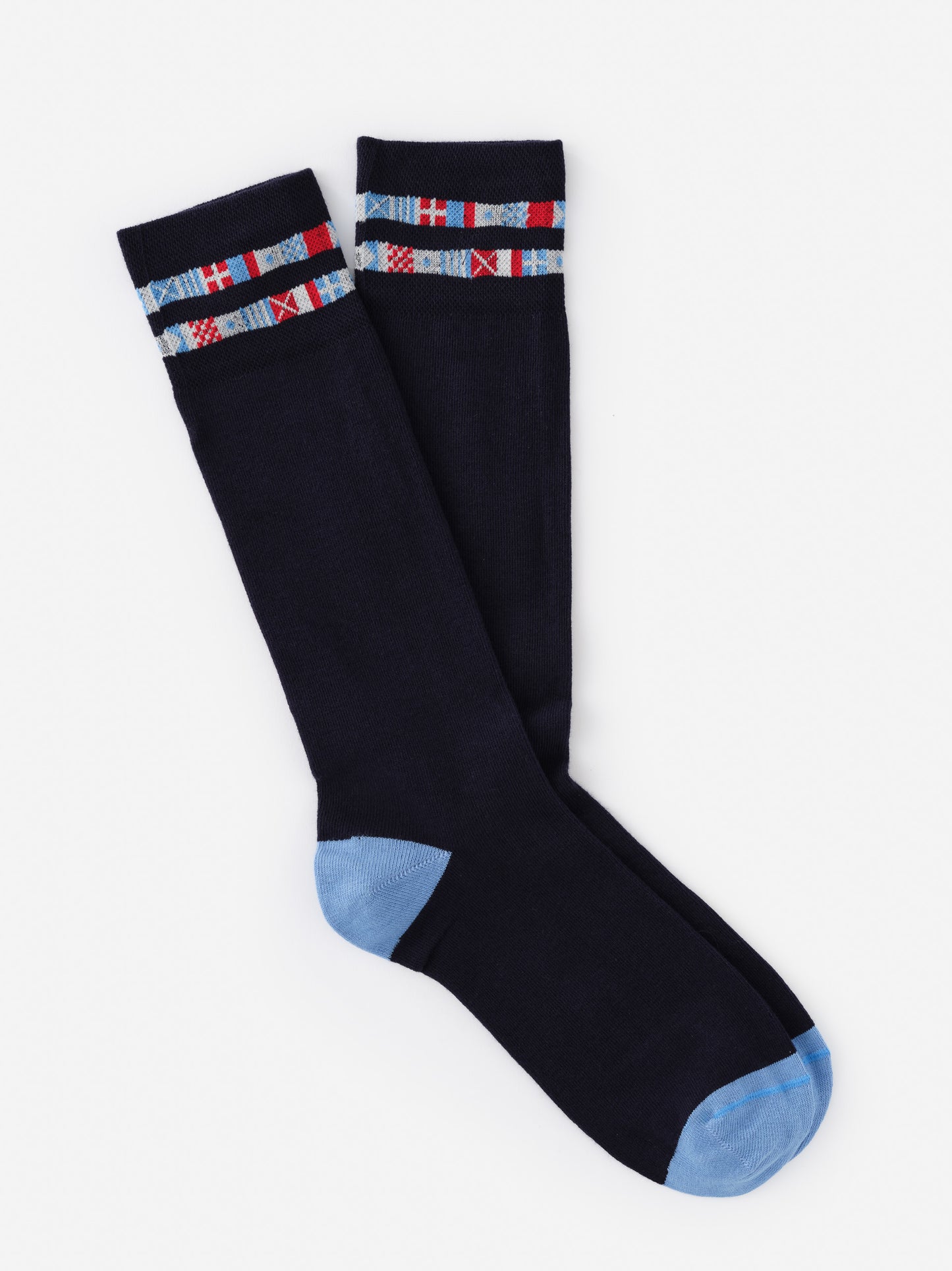 Pair of dark navy Socks in Nautical Flag by J.McLaughlin featuring light blue heel and toe accents with a striped nautical flag pattern near the top, effortlessly stylish with enduring designs.