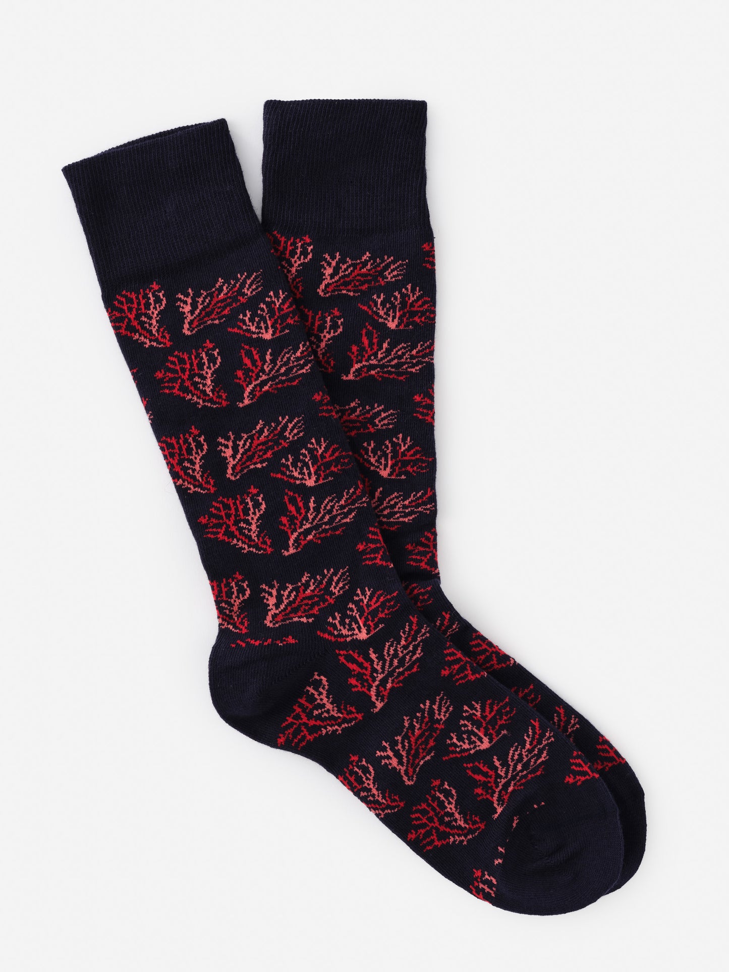 Pair of Socks in Midi Coral Cay Texture featuring coral-inspired pattern in red on navy, showcasing J.McLaughlin's legacy of timeless fashion with effortlessly stylish, enduring designs.