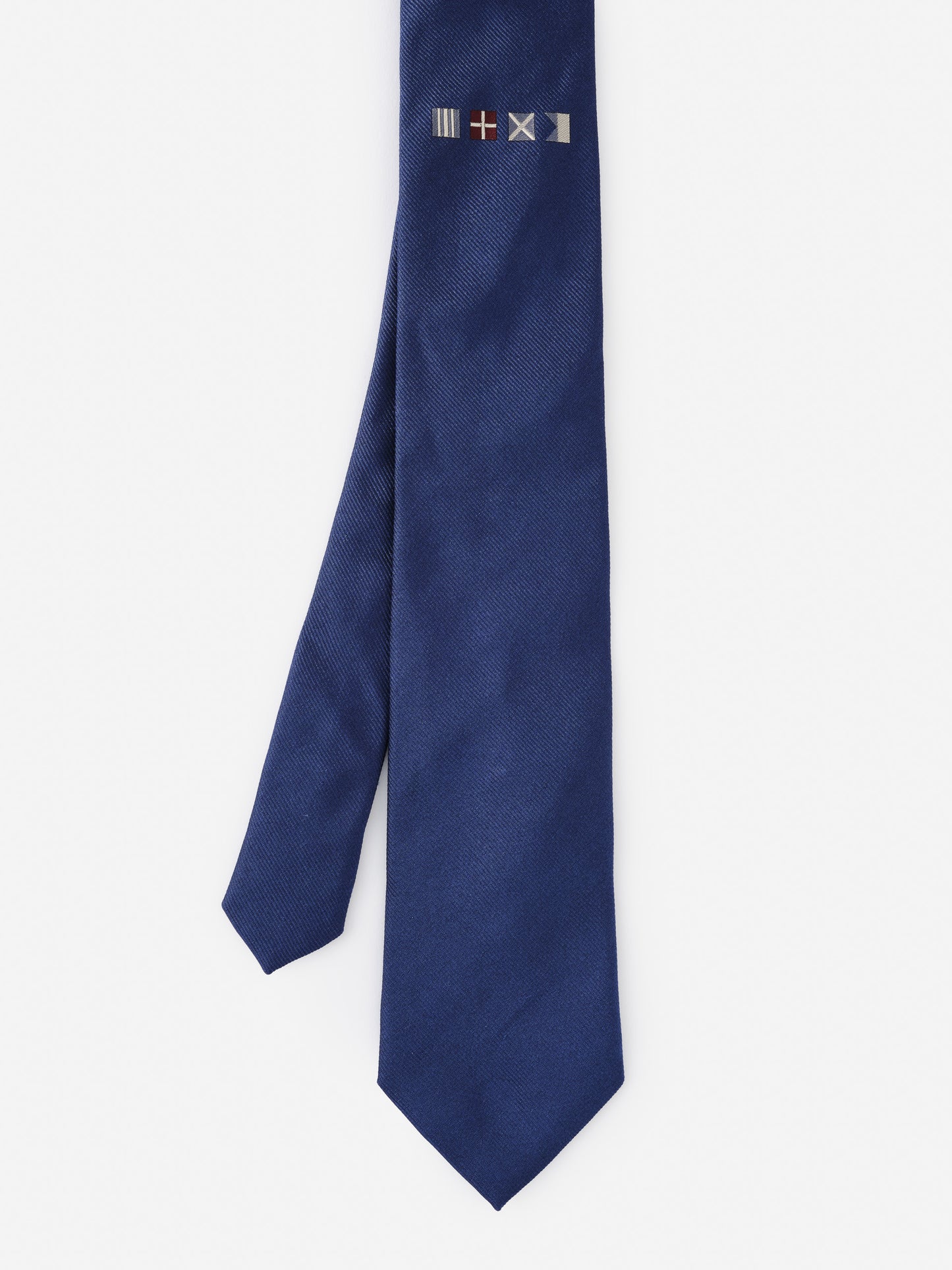 Silk Tie in Nautical Flag by J.McLaughlin, featuring a deep blue fabric with embroidered nautical flag accents, effortlessly stylish with enduring designs and innovative fabrics, a destination for defining style. Life, Well-Lived.