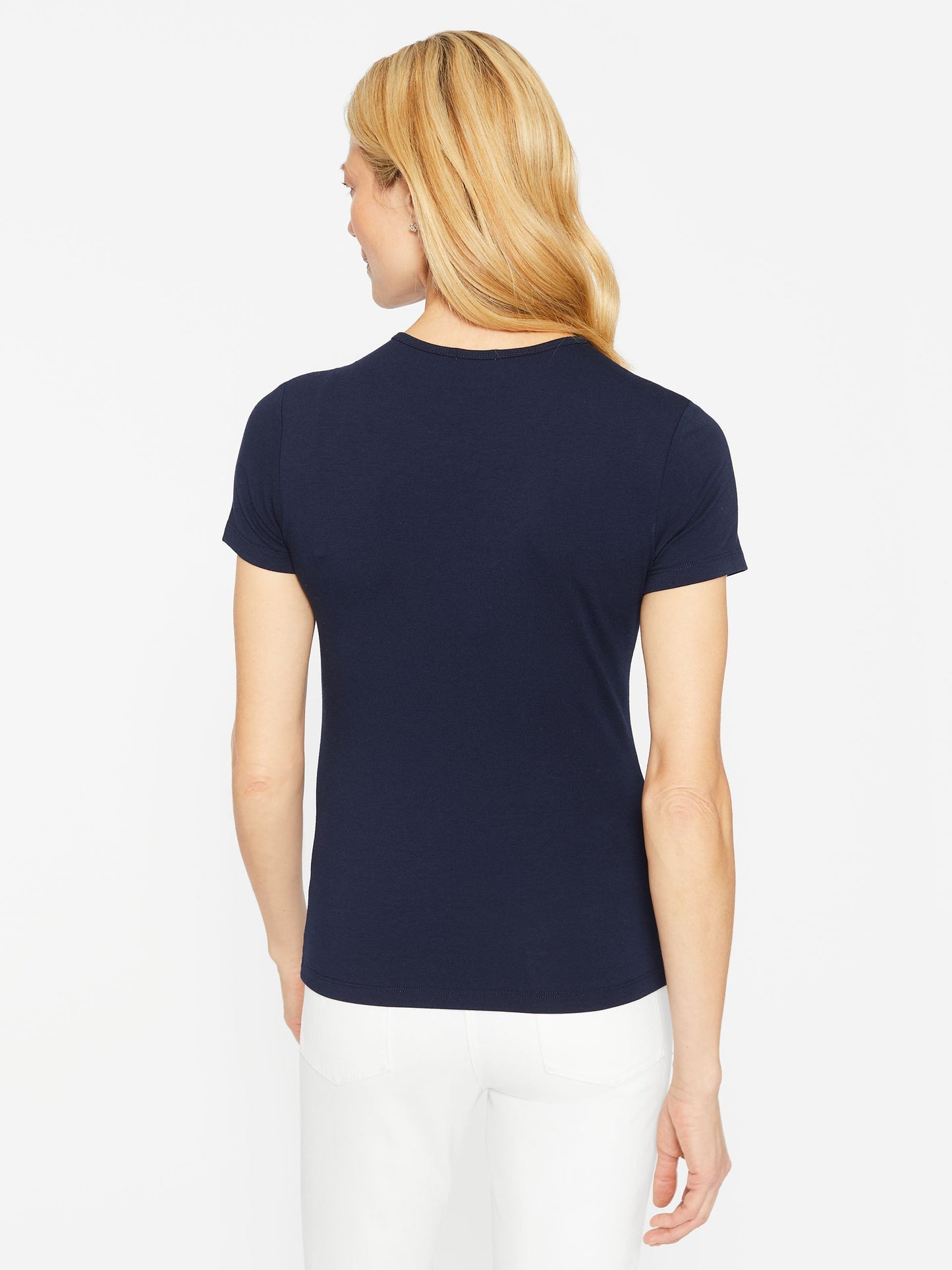 Model wearing J.McLaughlin Allie cap sleeve tee in navy made with cotton/modal.