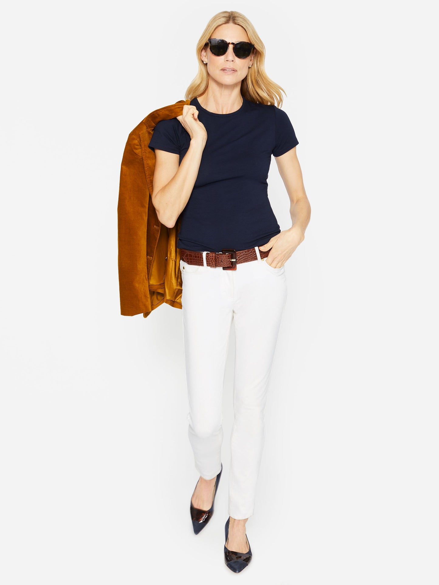 Model wearing J.McLaughlin Allie cap sleeve tee in navy made with cotton/modal.