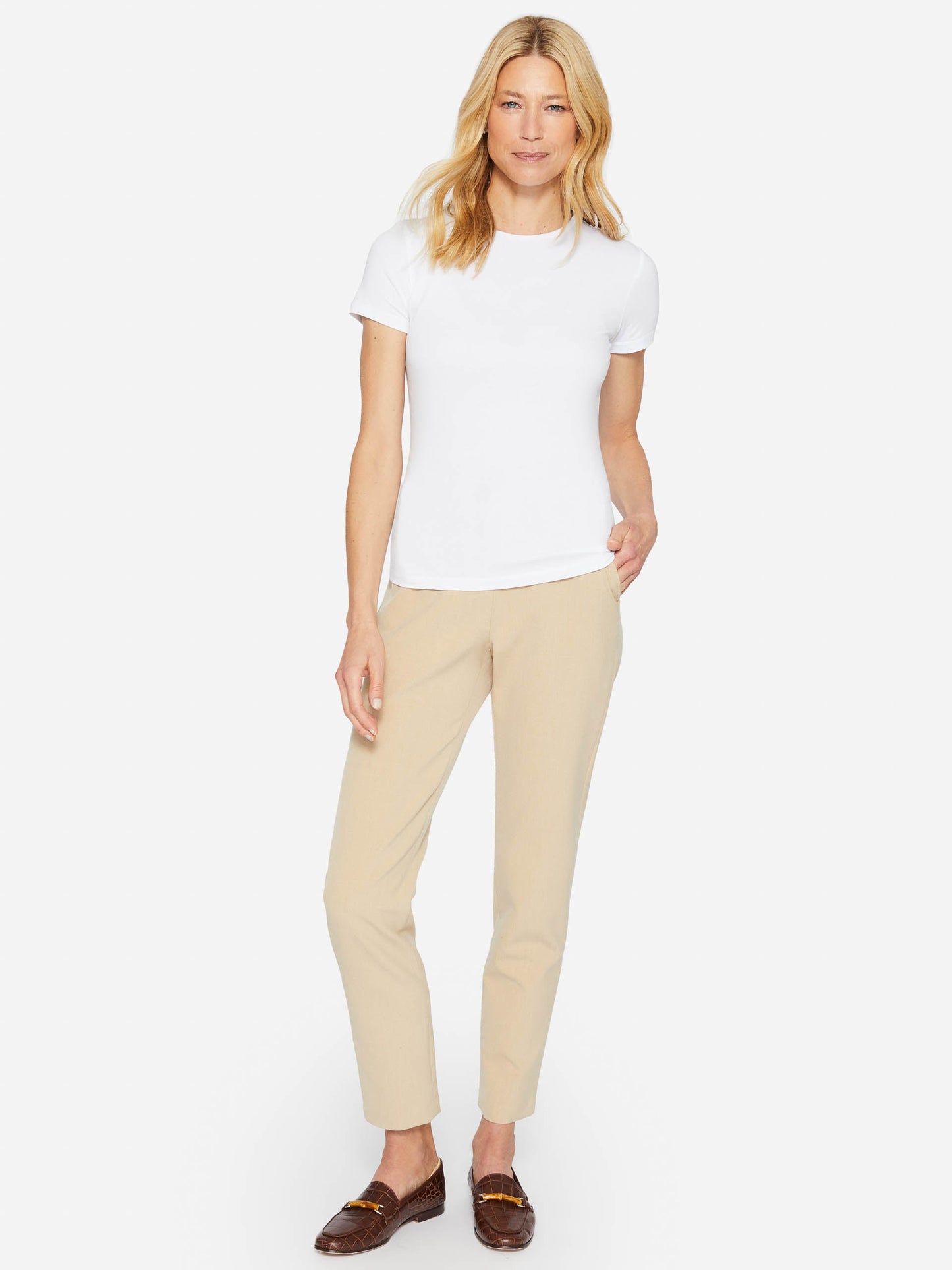 Model wearing J.McLaughlin Allie cap sleeve tee in white made with cotton/modal.