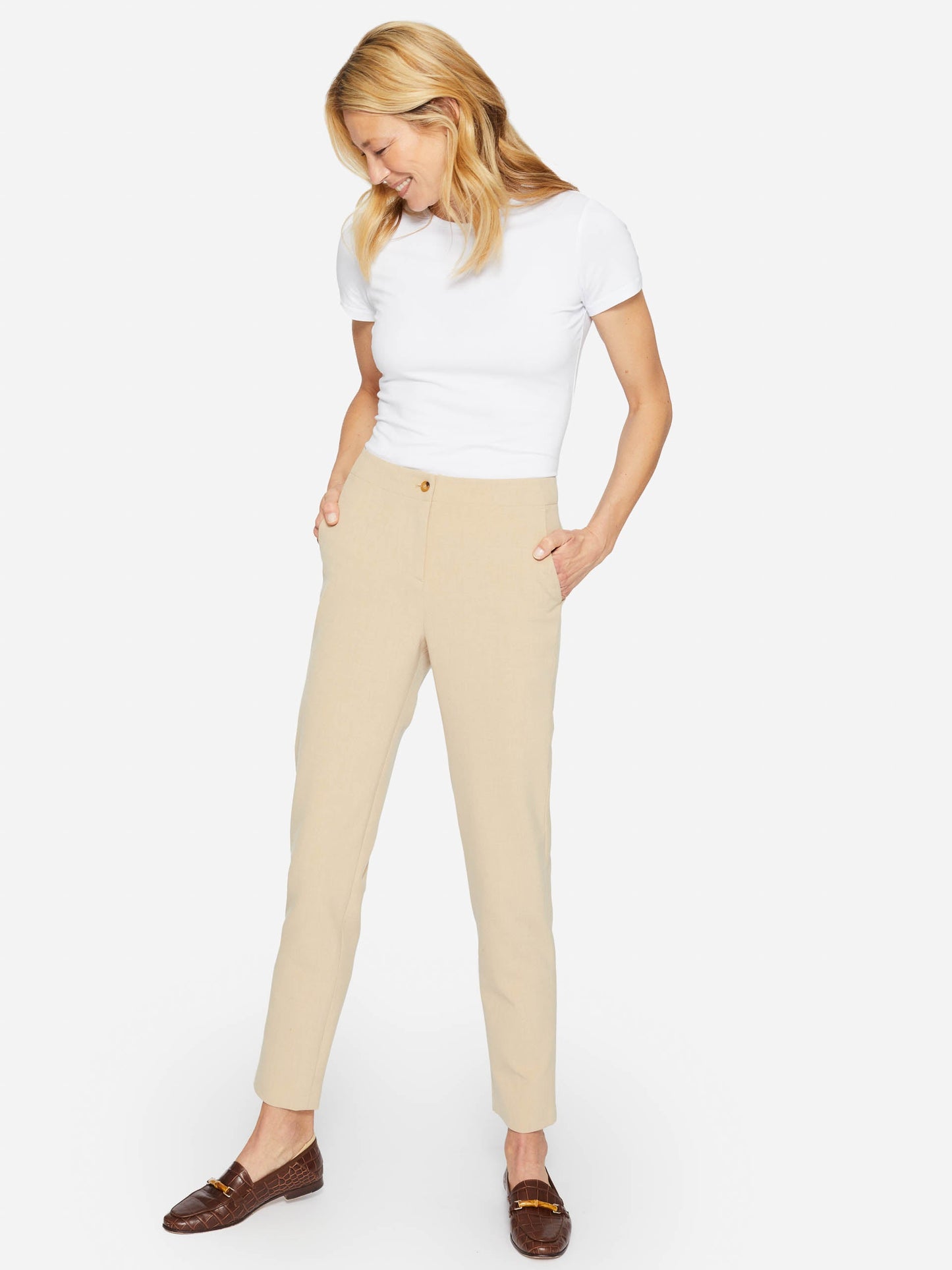 Model wearing J.McLaughlin Allie cap sleeve tee in white made with cotton/modal.