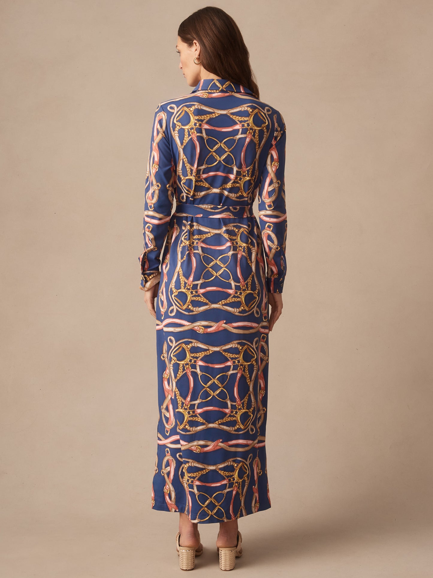 Woman wearing the Amory Maxi Dress in Mega Riding Lessons by J.McLaughlin, featuring a navy blue dress with an intricate rope and equestrian-inspired print, showcasing effortlessly stylish, enduring designs and innovative fabrics. A destination for defining style. Life, Well-Lived.