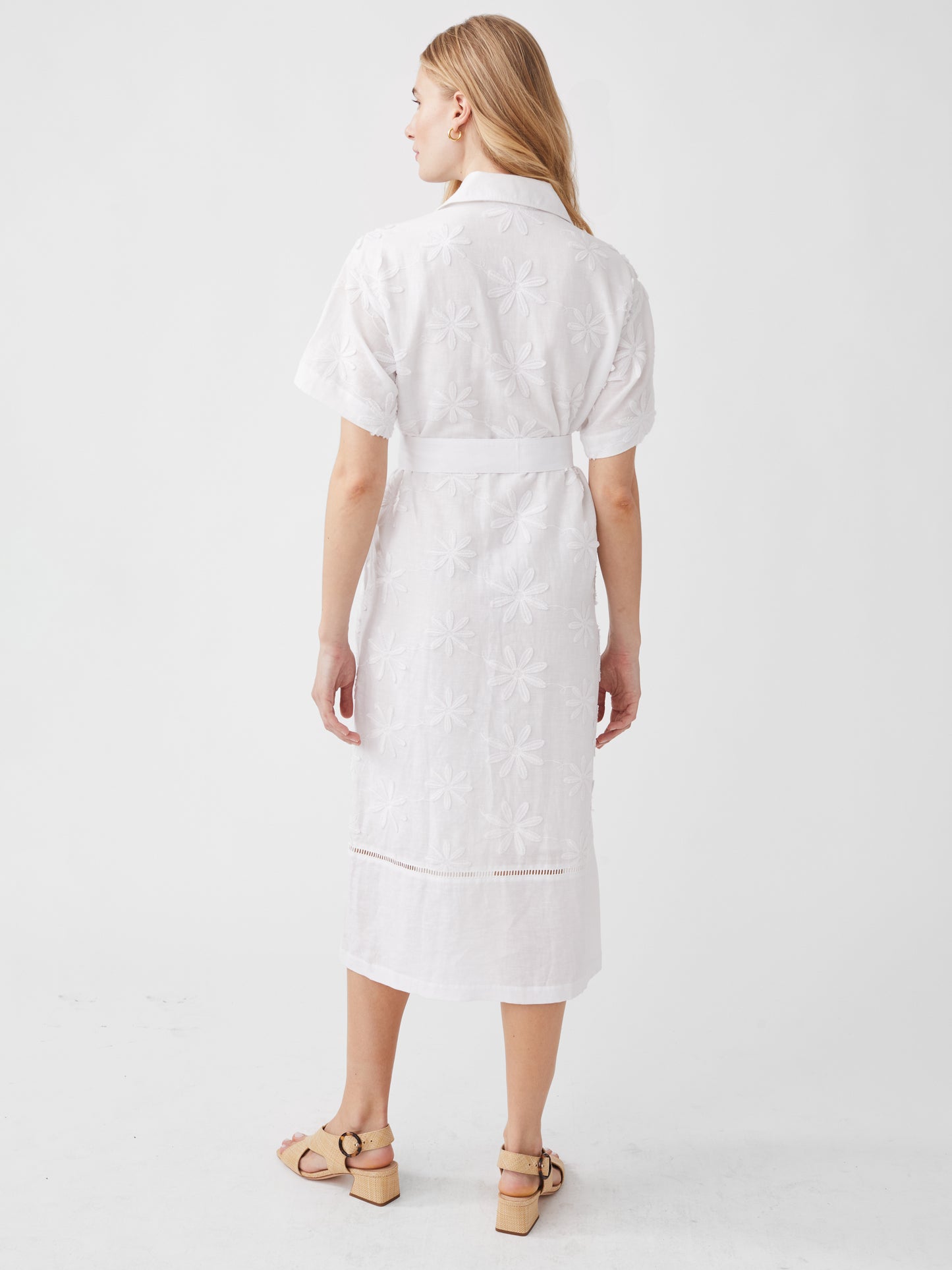 Model wearing J.McLaughlin Anamaria dress in white made with linen and cotton.