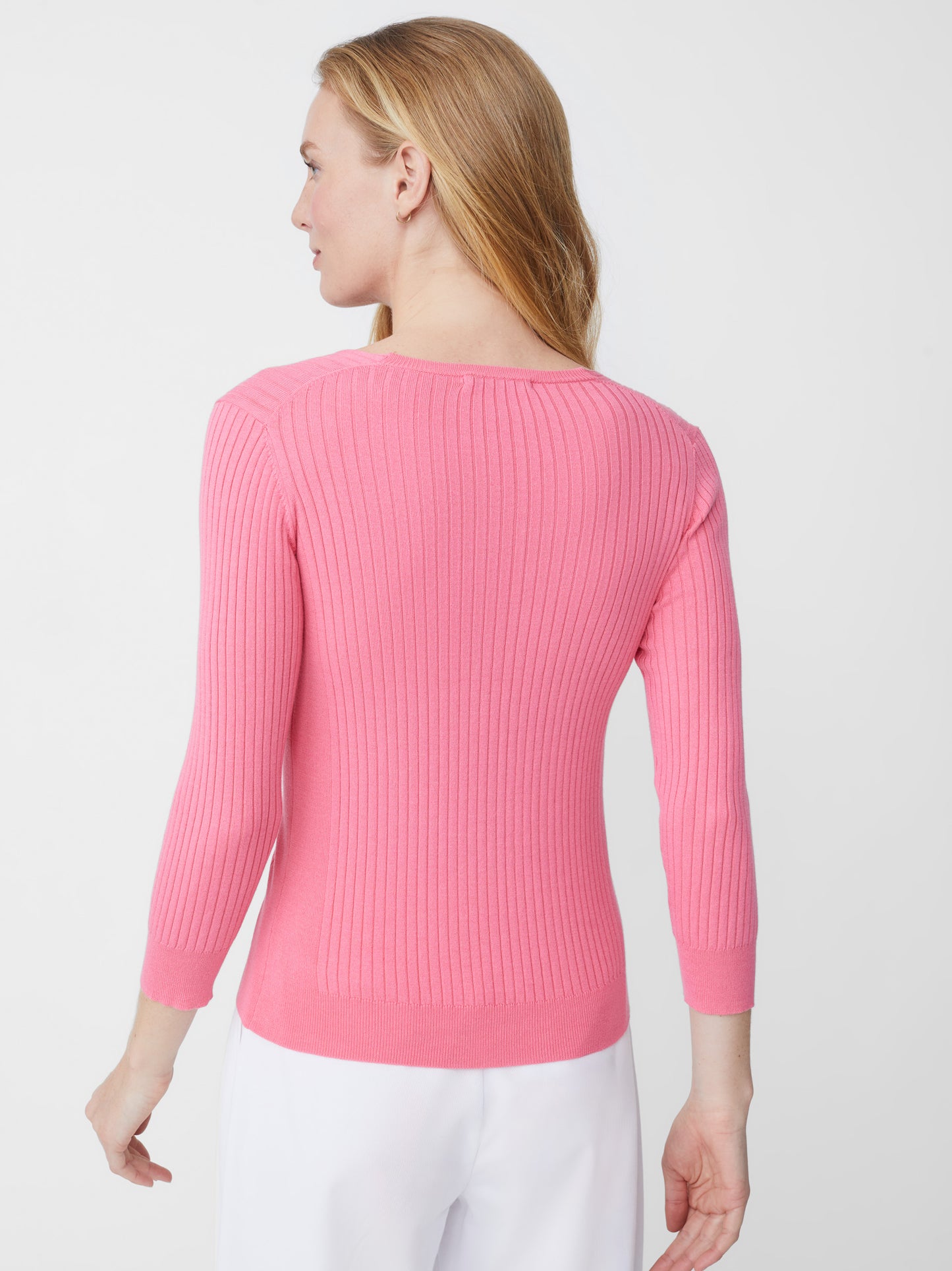 Model wearing J.McLaughlin Anouk sweater in blushing pink made with cotton/modal.