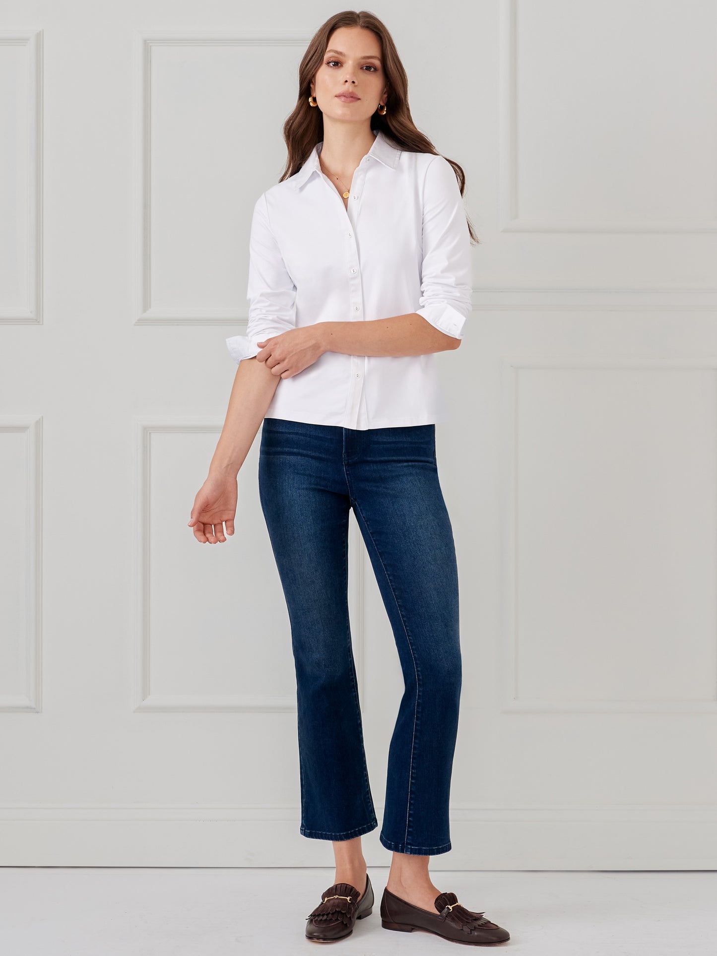 Model wearing J.McLaughlin Betty shirt in white made with Catalina cloth.
