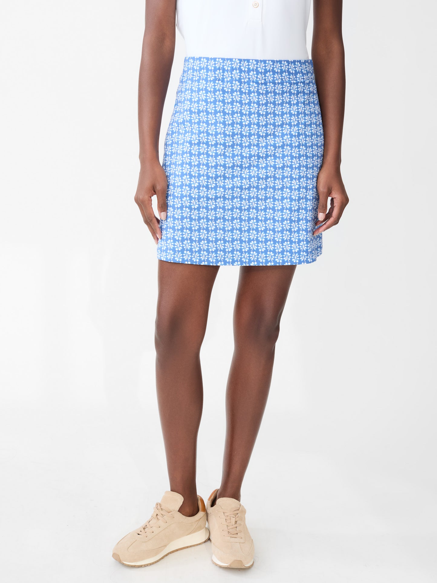 Model wearing J.McLaughlin Briana skort in navy/white/blue made with Catalina cloth.