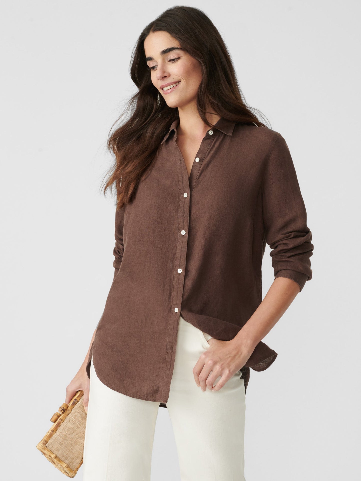 Model wearing J.McLaughlin Britt shirt in dark brown made with linen.