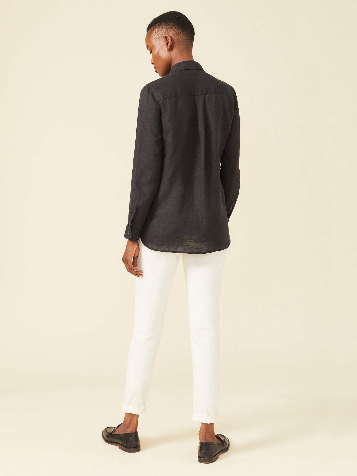 Model wearing J.McLaughlin Britt shirt in black made with linen.