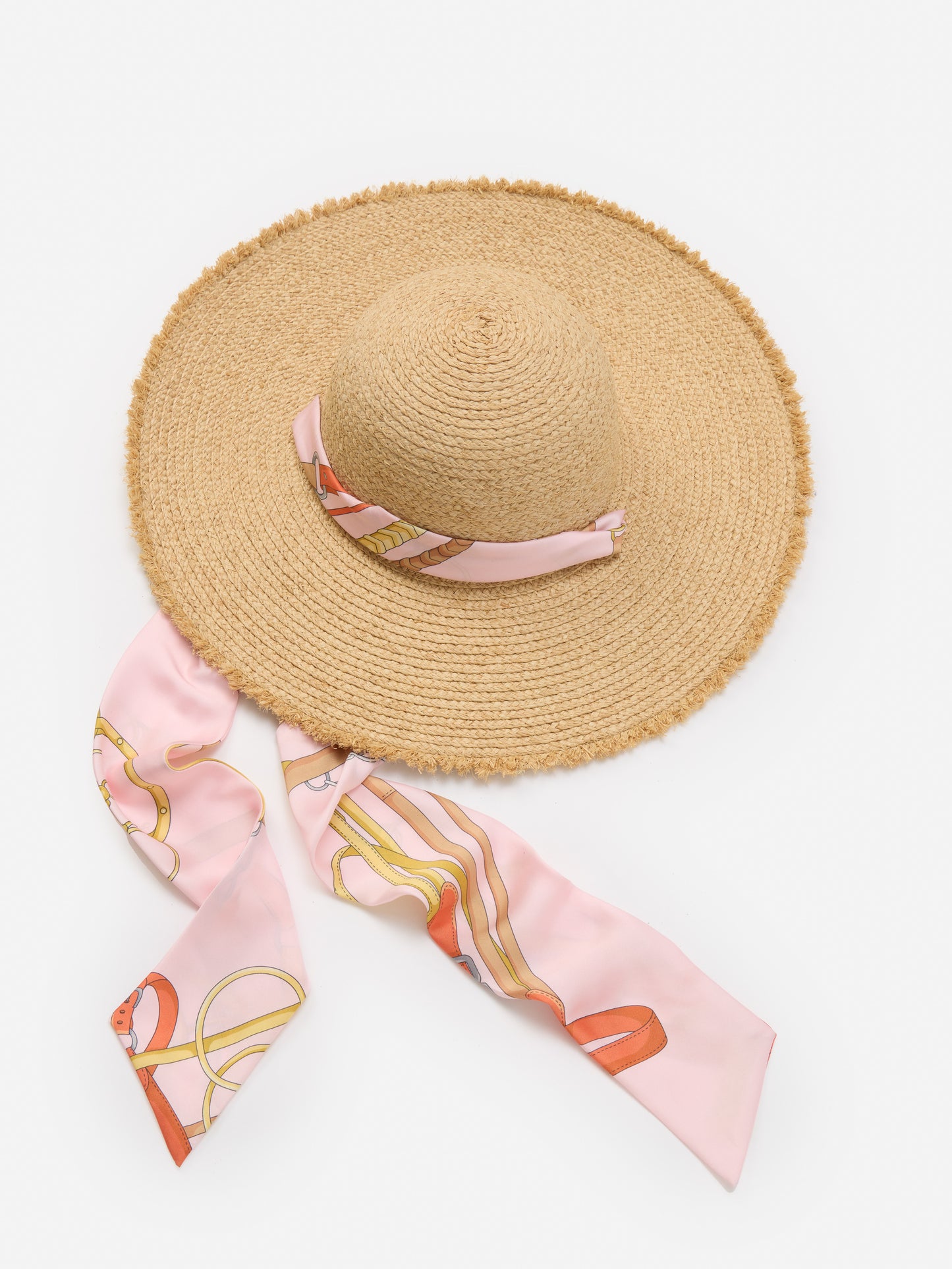 Model wearing J.McLaughlin Brooke hat in light pink/pink made with raffia.