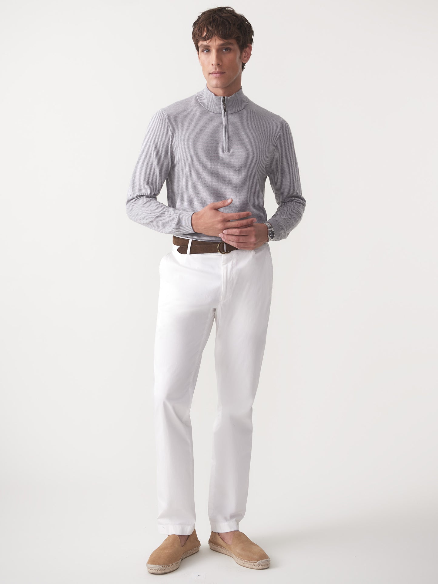 Model wearing J.McLaughlin Brookhaven sweater in gray/light gray made with cotton, viscose, nylon, and cashmere.