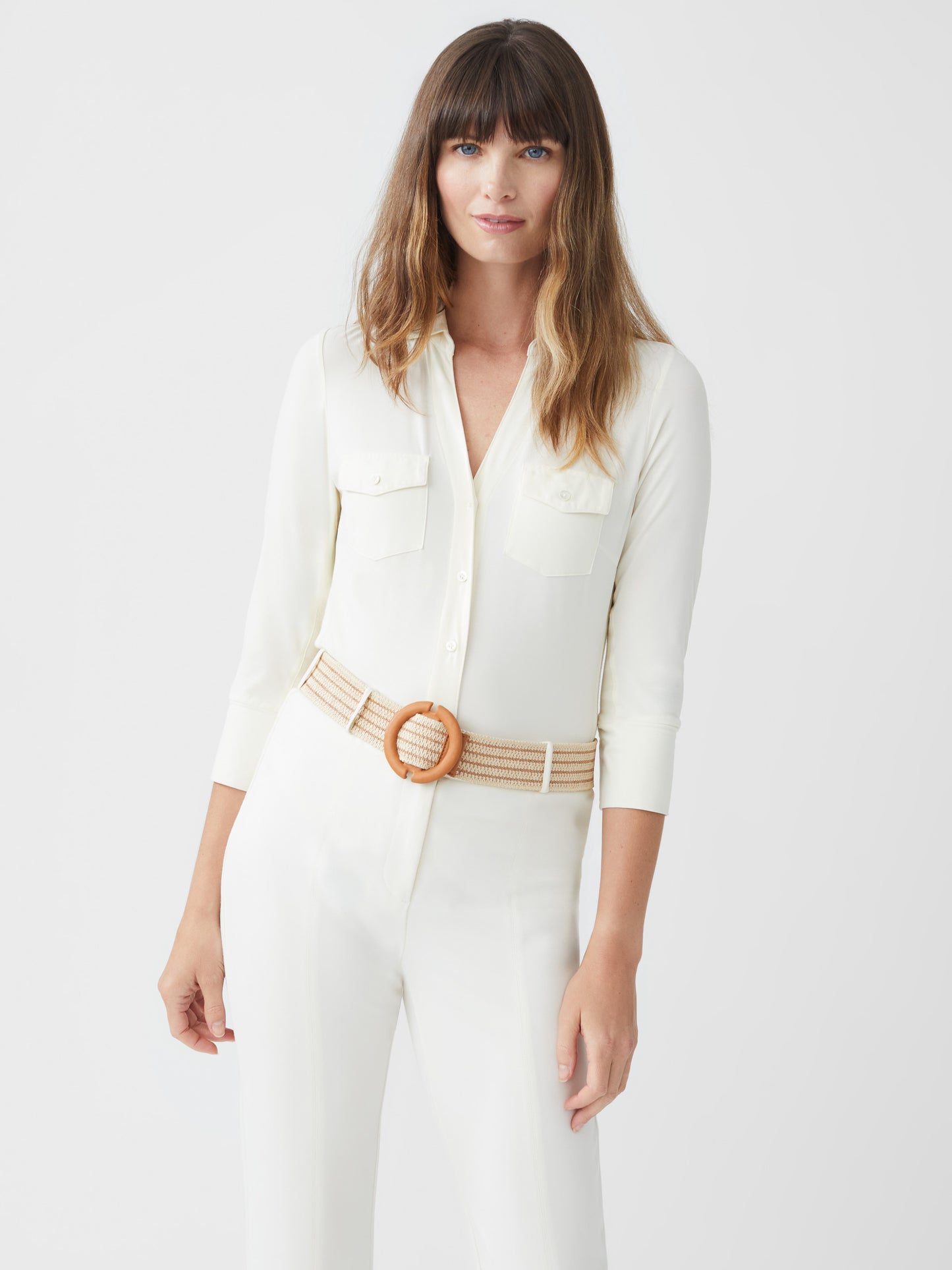 Model wearing J.McLaughlin Brynn shirt in off white made with lyford jersey.