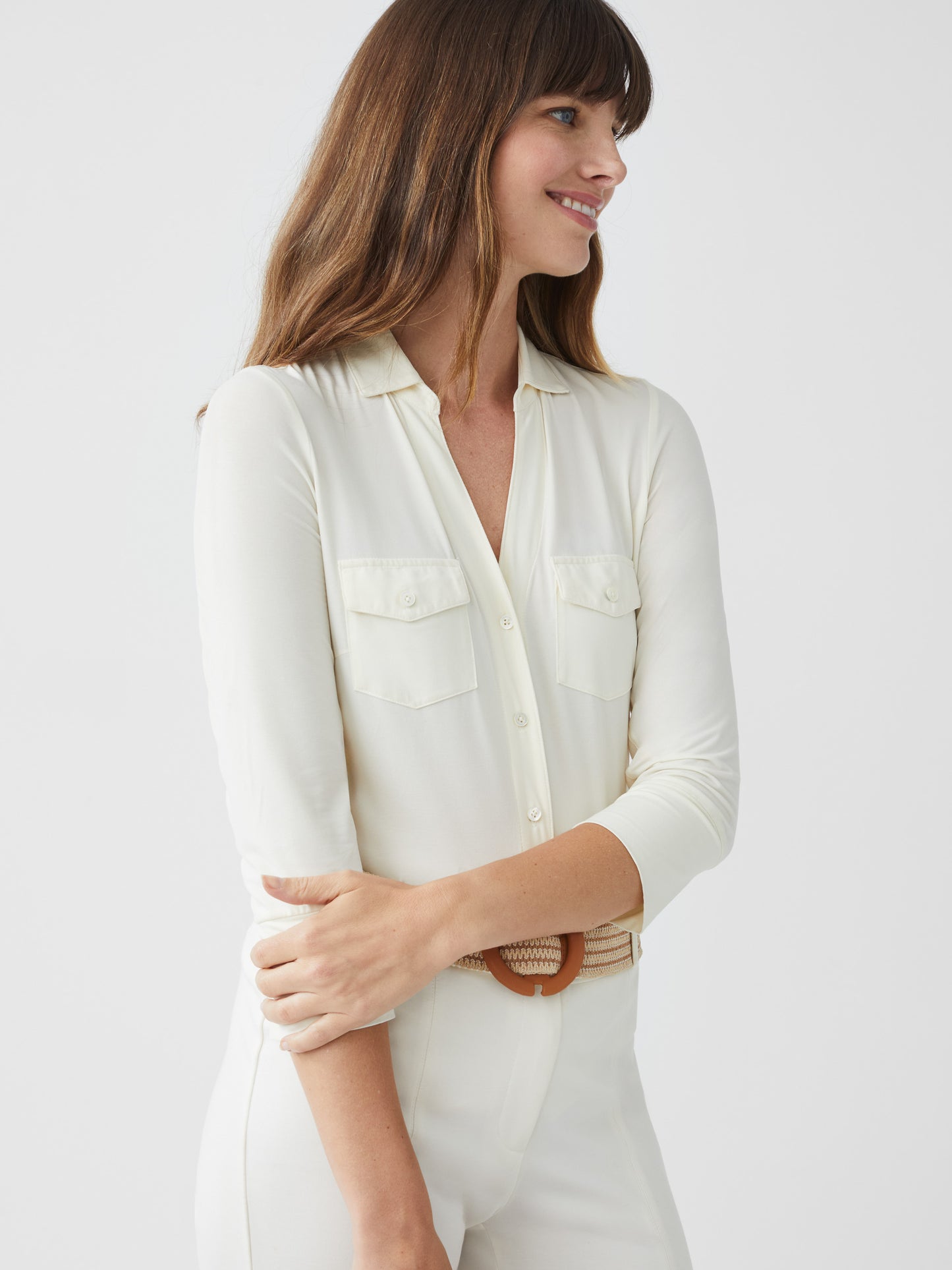 Model wearing J.McLaughlin Brynn shirt in off white made with lyford jersey.