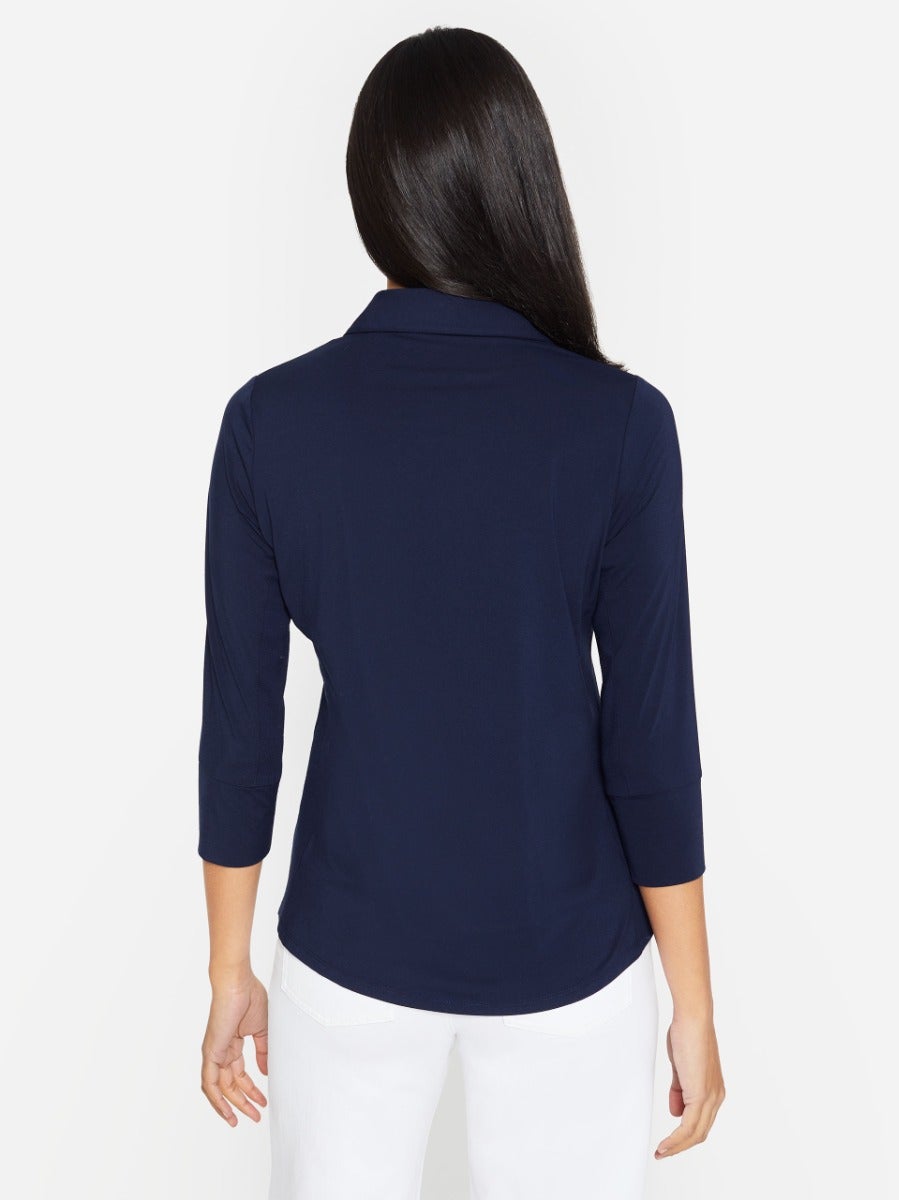 Model wearing Brynn shirt in navy made with lyford jersey.