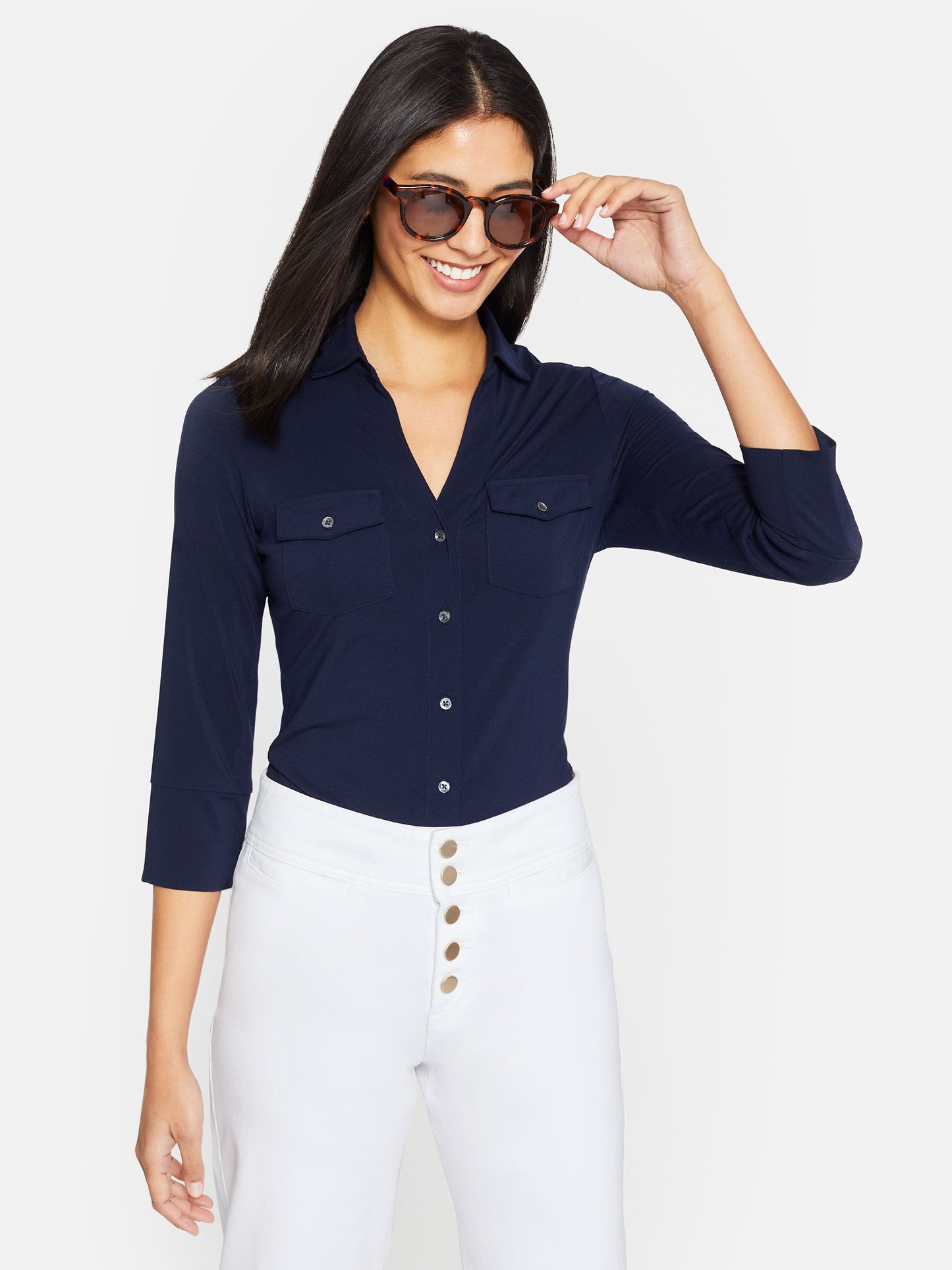 Model wearing Brynn shirt in navy made with lyford jersey.