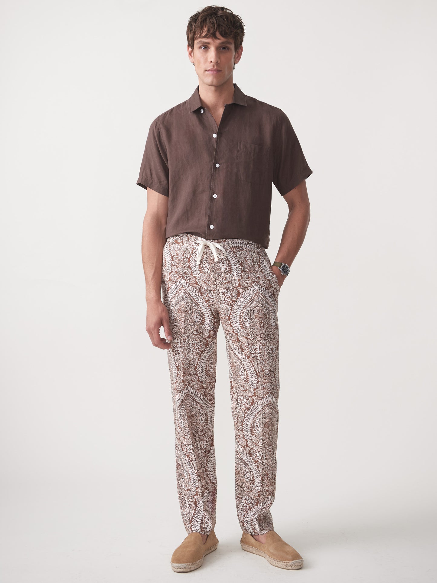 Model wearing J.McLaughlin Callister pants in off white/brown made with linen.