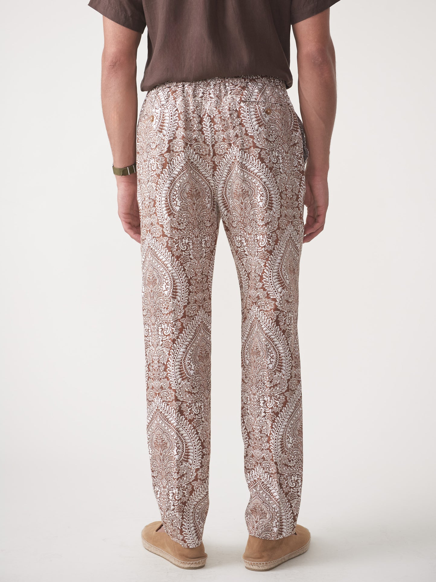 Model wearing J.McLaughlin Callister pants in off white/brown made with linen.