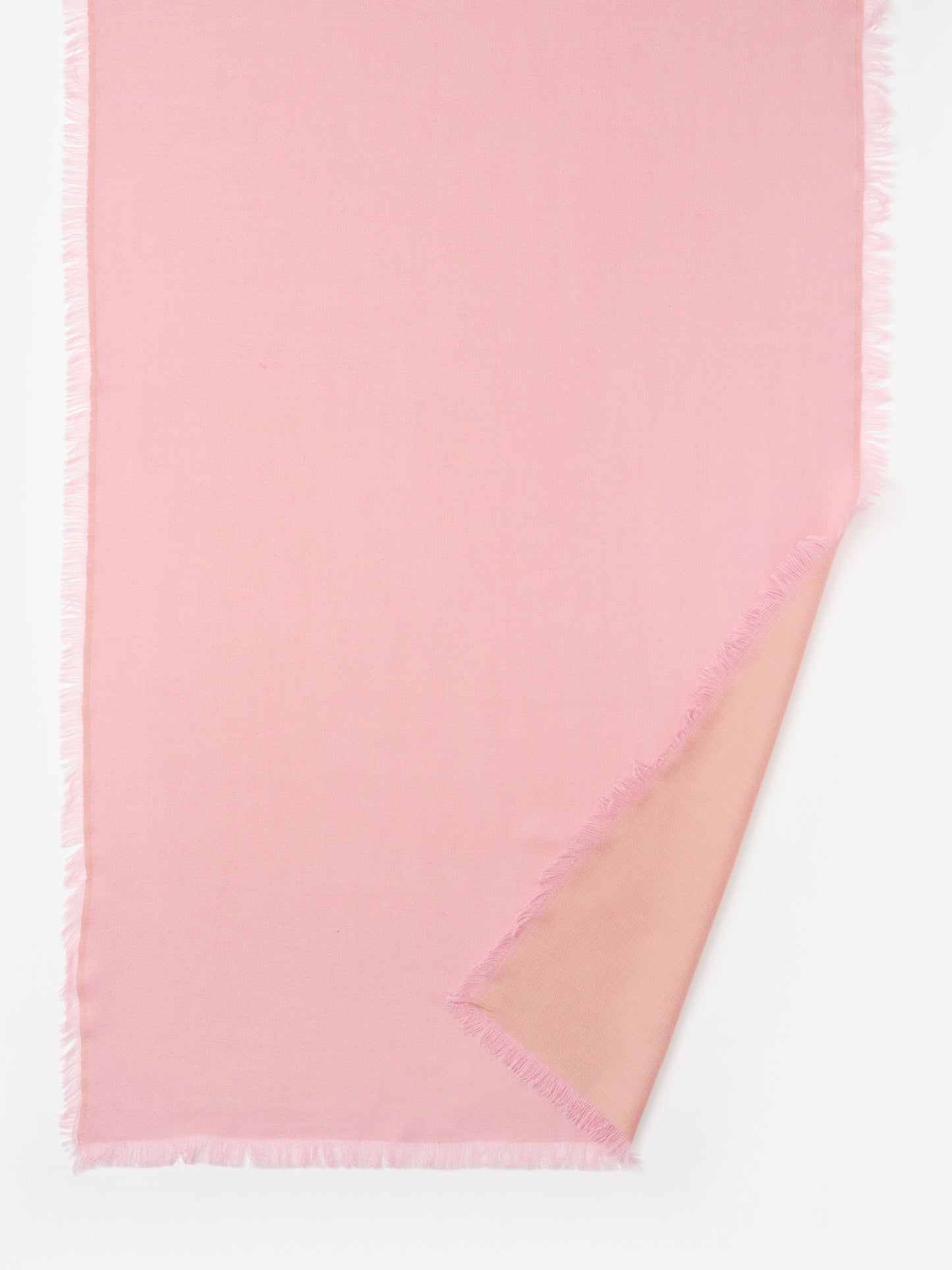 Soft pink Carey Cashmere Scarf by J.McLaughlin, showcasing effortlessly stylish design and enduring craftsmanship with delicate fringed edges, a destination for defining style. Life, Well-Lived.