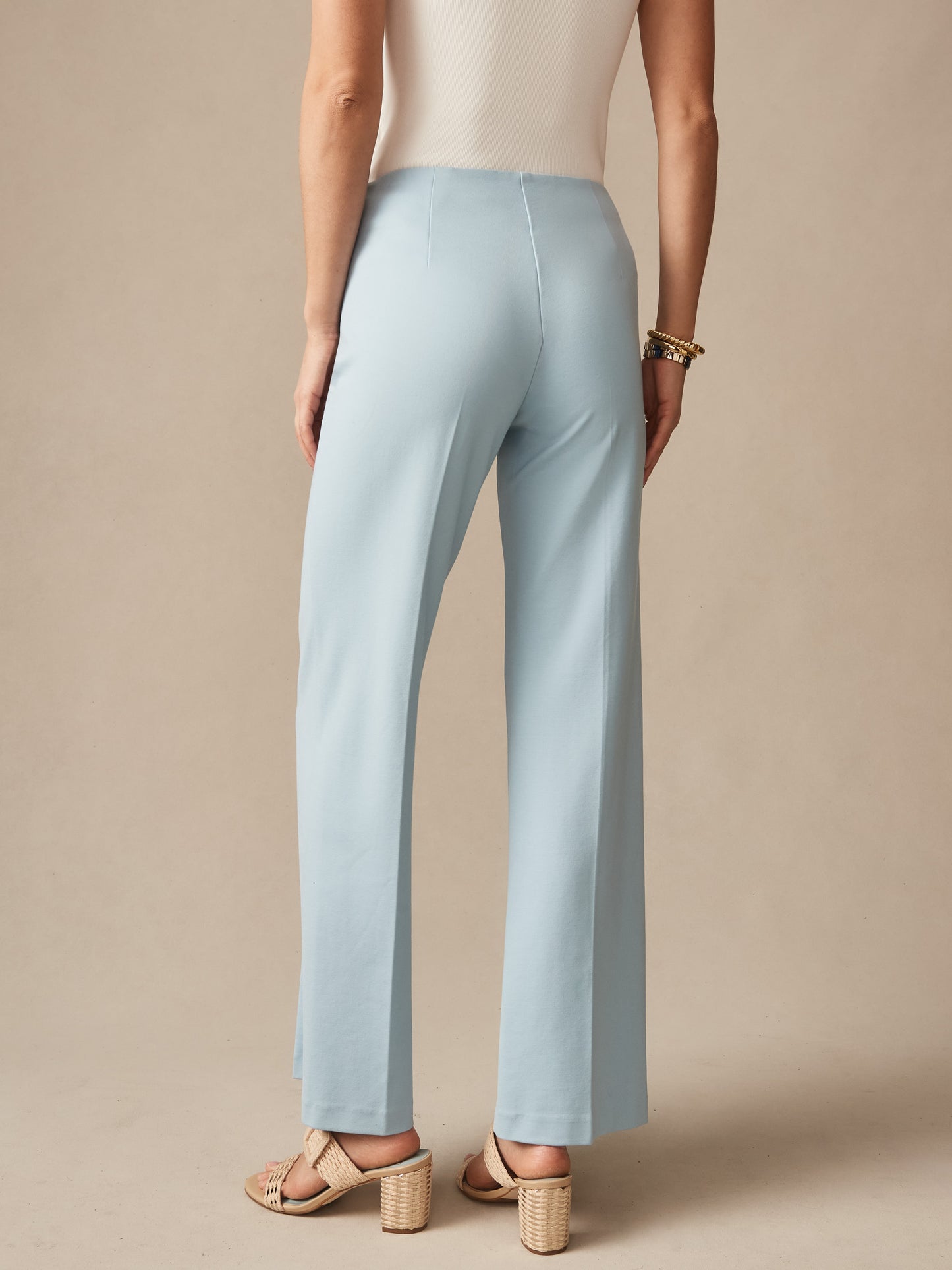 Woman wearing sky blue Carter Pants by J. McLaughlin, featuring a classic, effortless style and enduring design, perfect for a destination defining style and life well-lived.