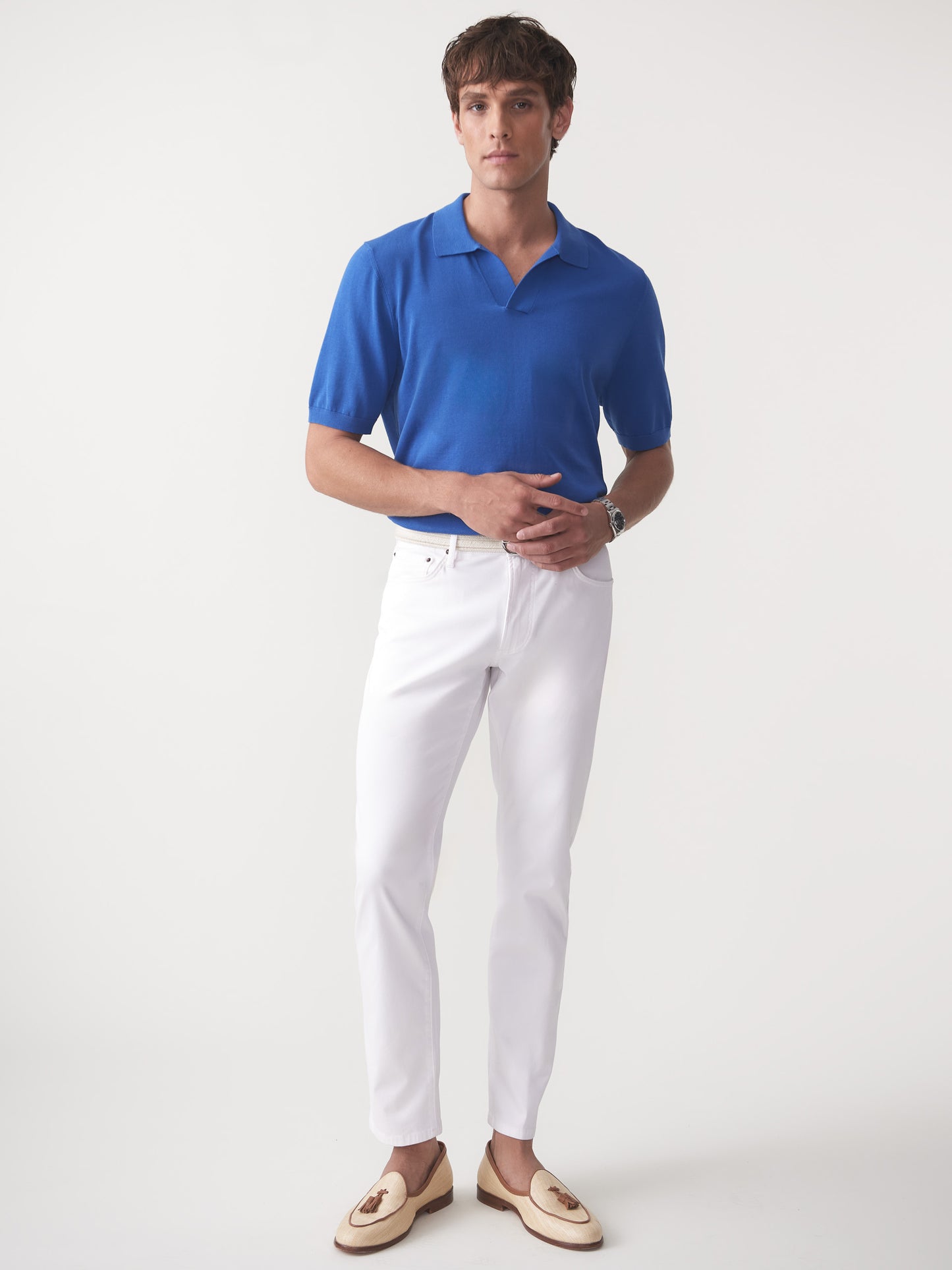 Model wearing J.McLaughlin Cillian sweater polo in blue made with cotton.