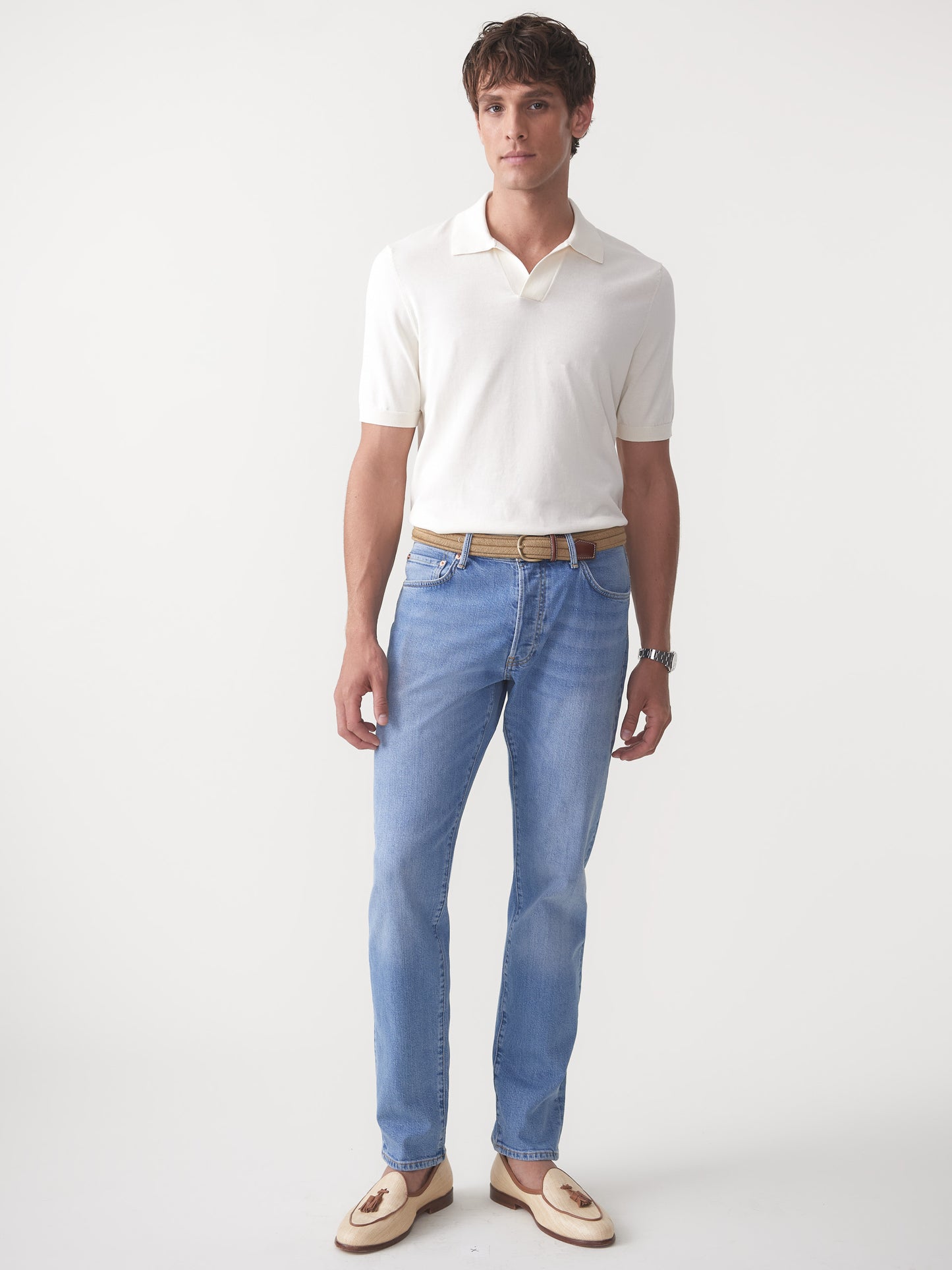 Model wearing J.McLaughlin Cillian sweater polo in egret white made with cotton.