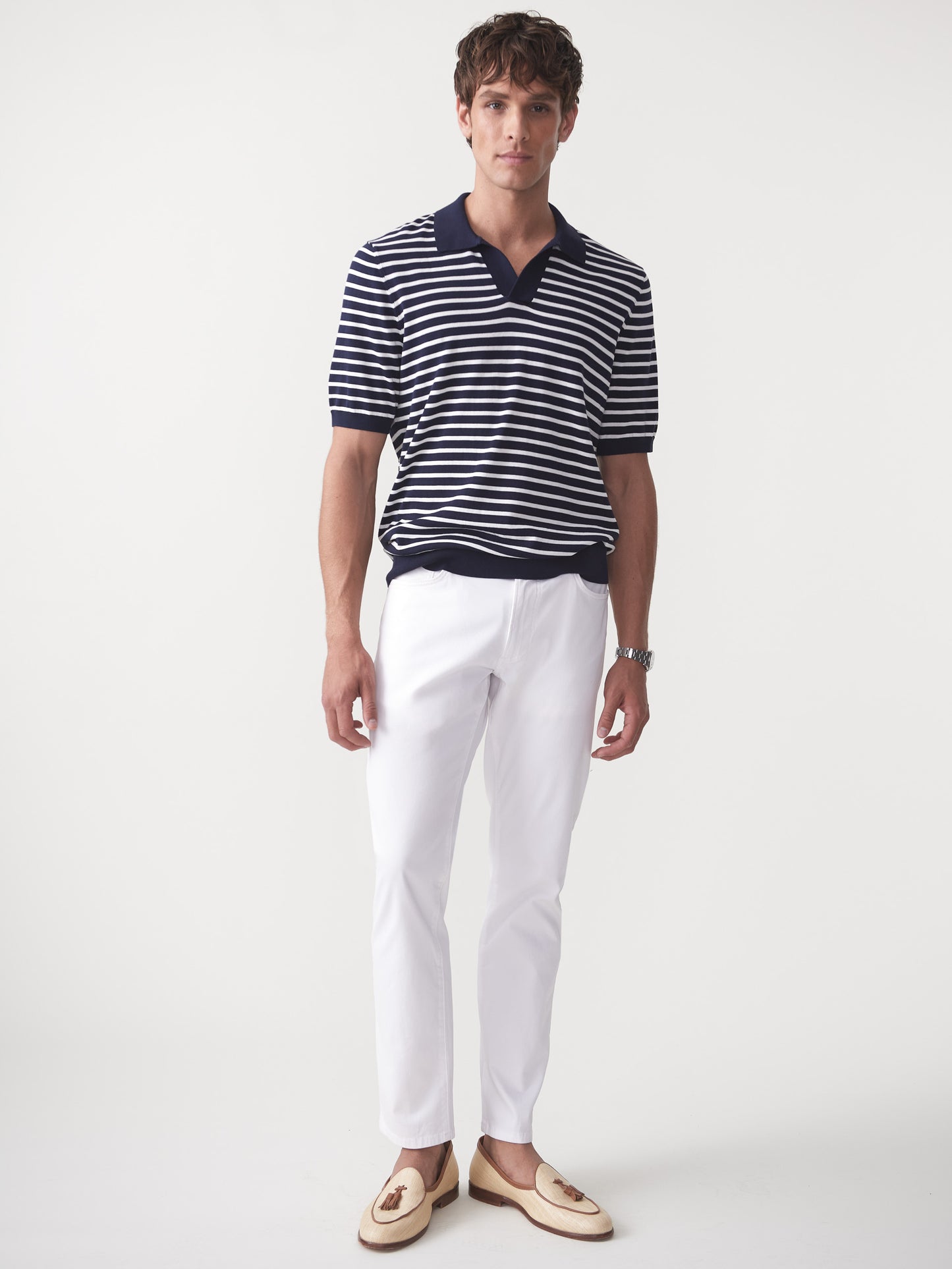 Model wearing J.McLaughlin Amalfi sweater polo in navy/egret white made with cotton.