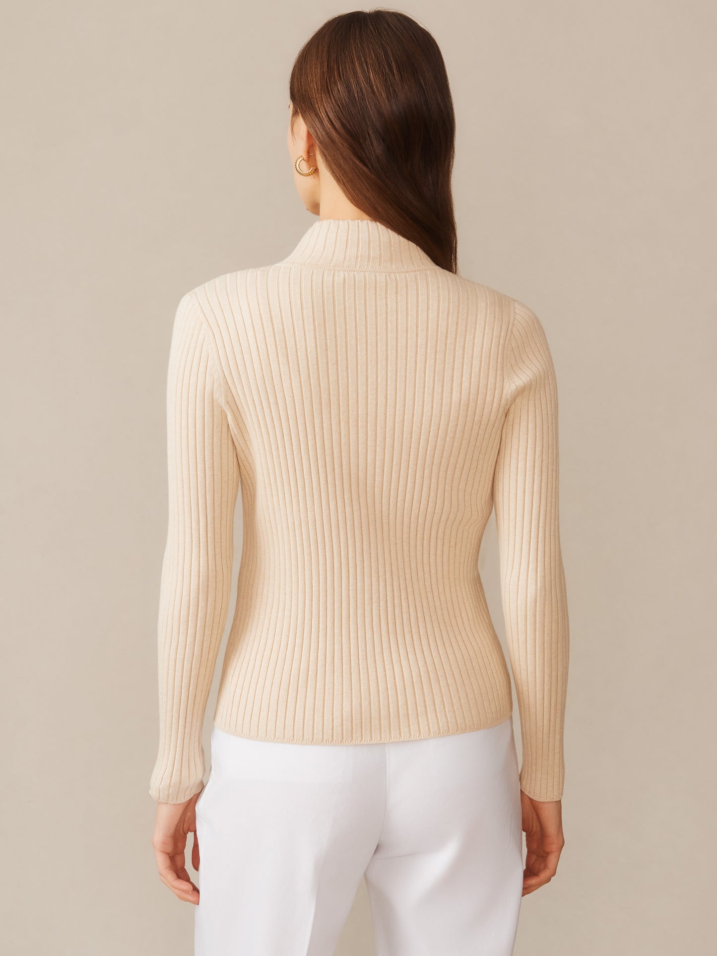 Back view of a woman wearing the Clemence Zip Cardigan by J.McLaughlin in oatmeal, featuring a ribbed texture and a fitted silhouette, exemplifying effortlessly stylish, enduring designs and innovative fabrics.