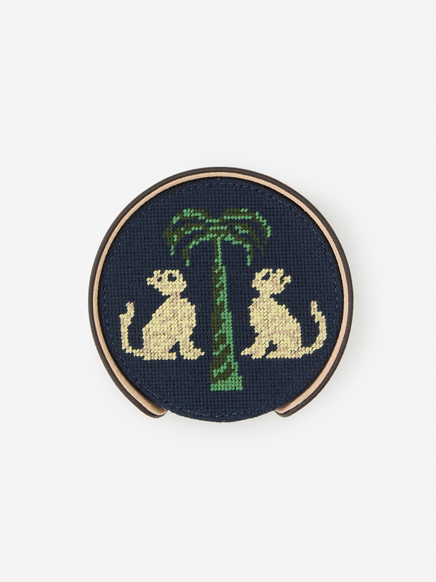 J.McLaughlin Coaster set in dark brown/khaki made with cotton needlepoint and leather.