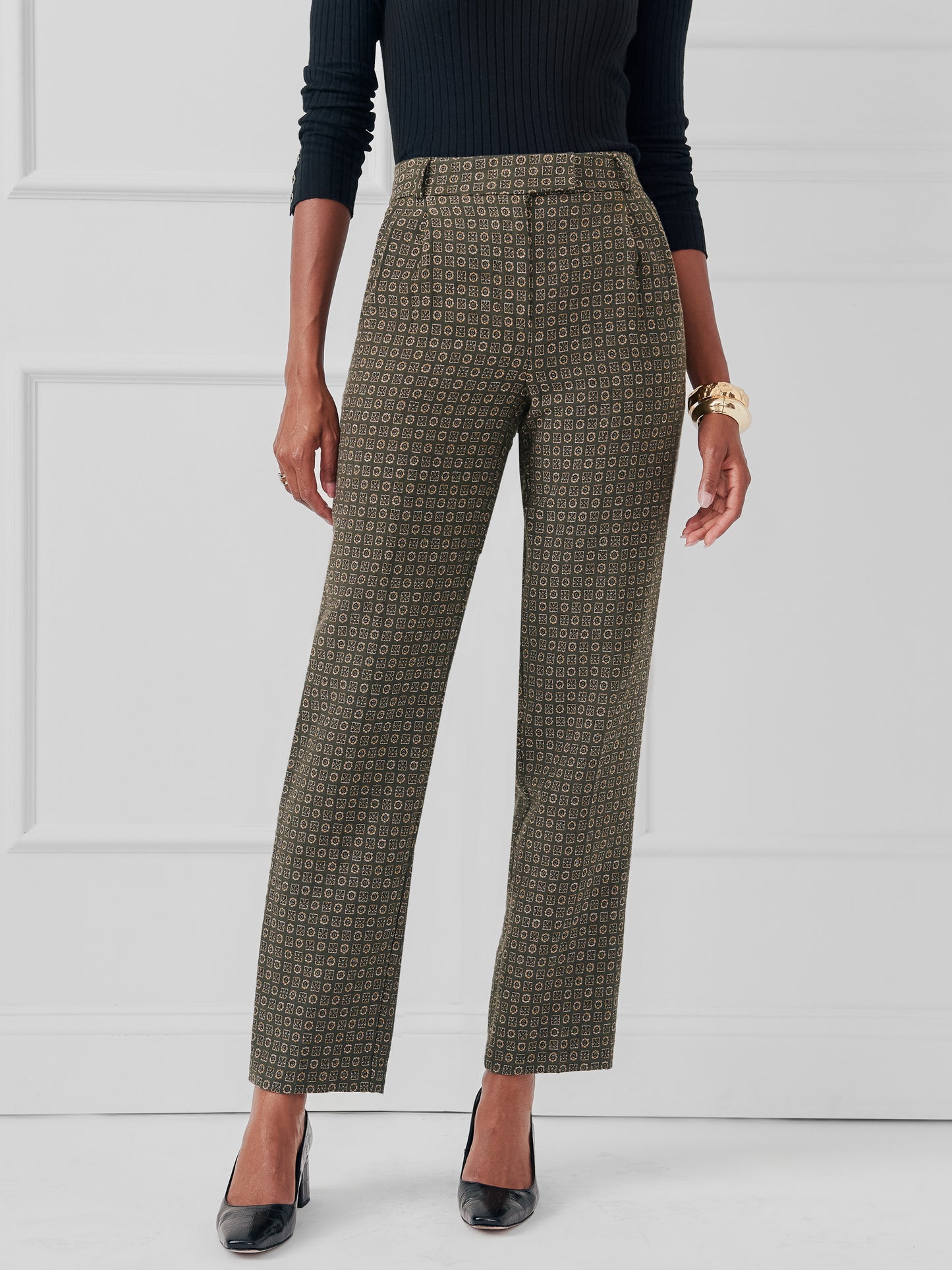 Model wearing J.McLaughlin Colleen pants in green made with poly/cotton.