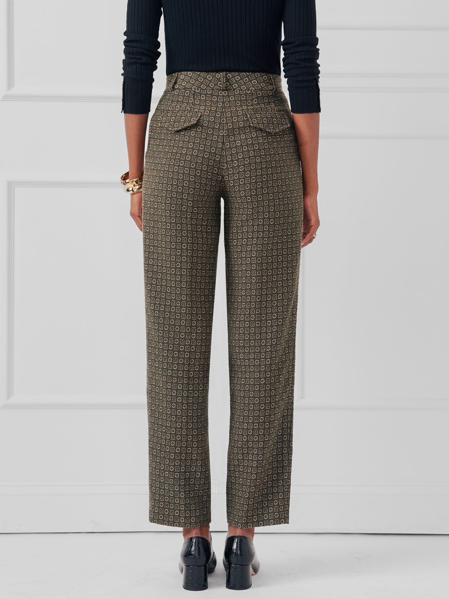 Model wearing J.McLaughlin Colleen pants in green made with poly/cotton.