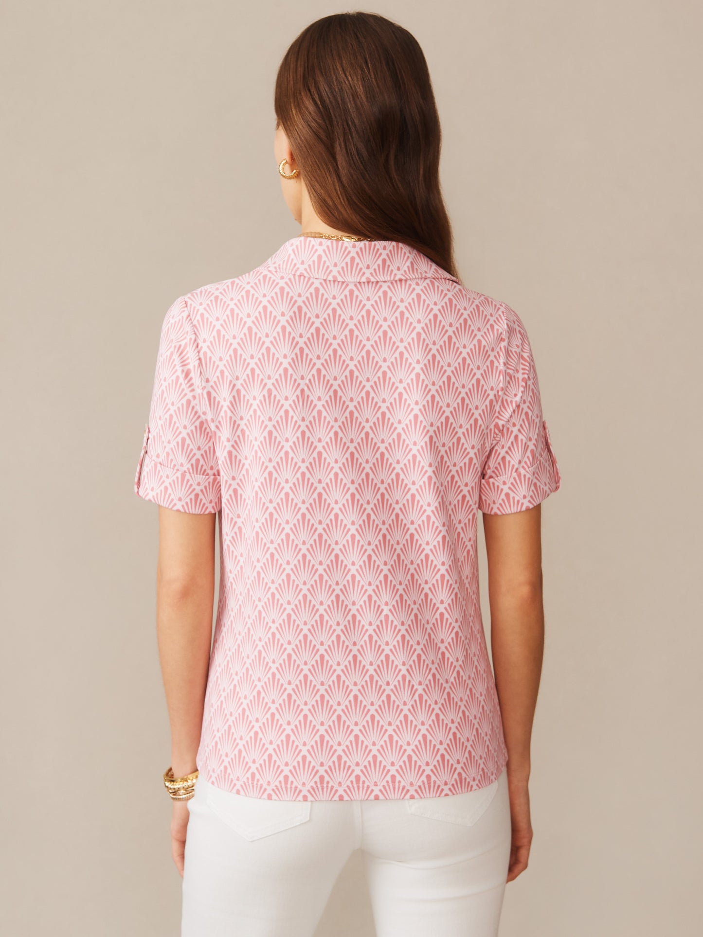 Back view of a woman wearing the Cornelia Shirt in Sandshell by J.McLaughlin, featuring an effortlessly stylish pink patterned shirt with short sleeves, embodying enduring designs and a legacy of timeless fashion. A destination for defining style. Life, Well-Lived.