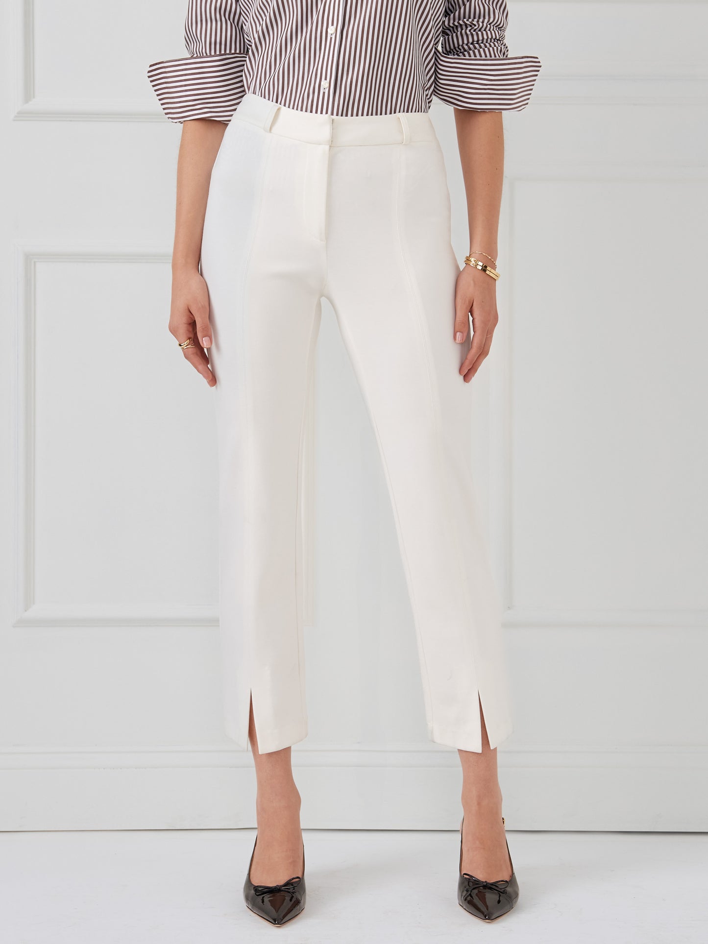 Model wearing J.McLaughlin Deanne pants in ivory made with Bainbridge fabric.