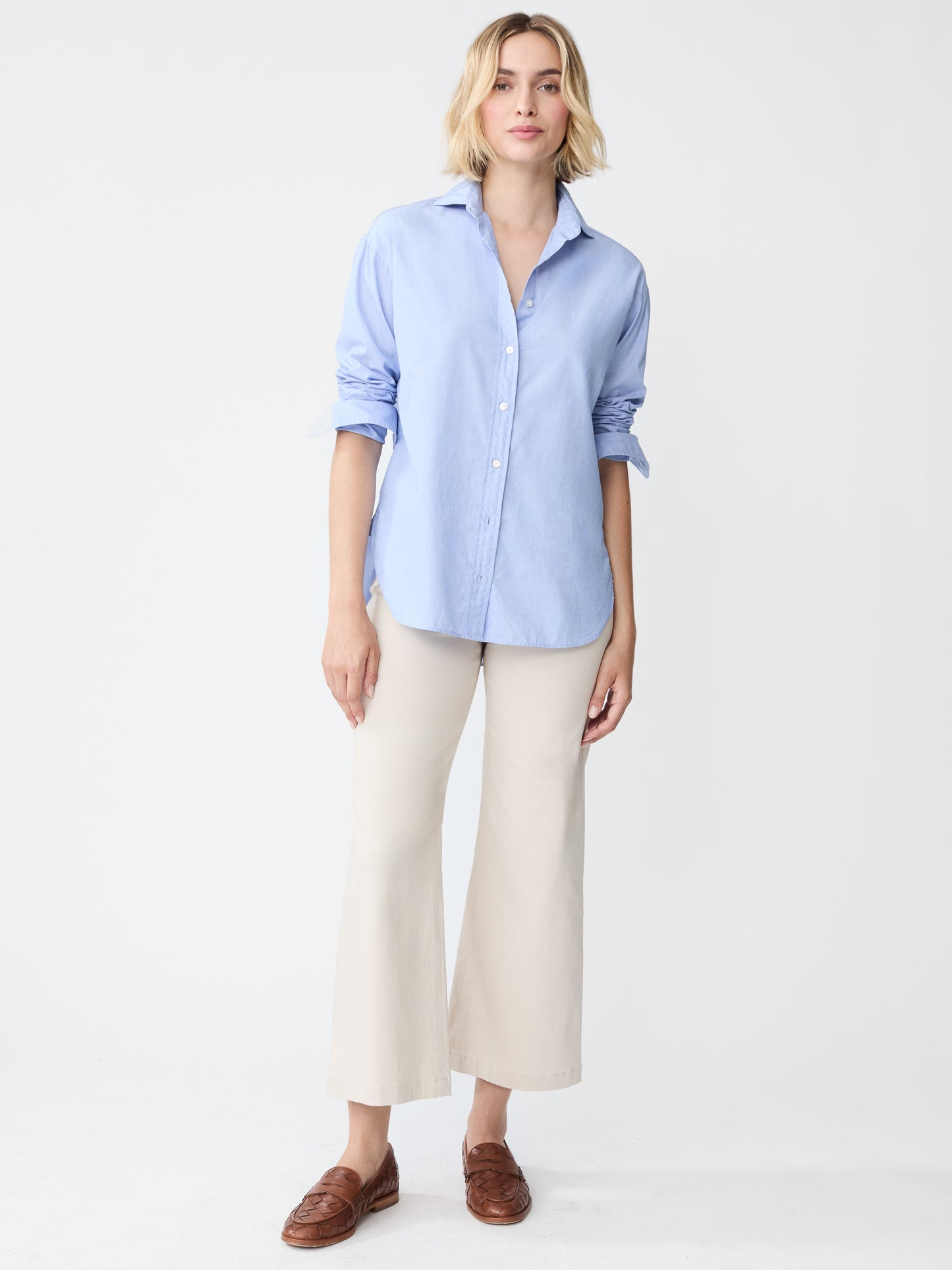 Model wearing J.McLaughlin Finn shirt in blue made with cotton.