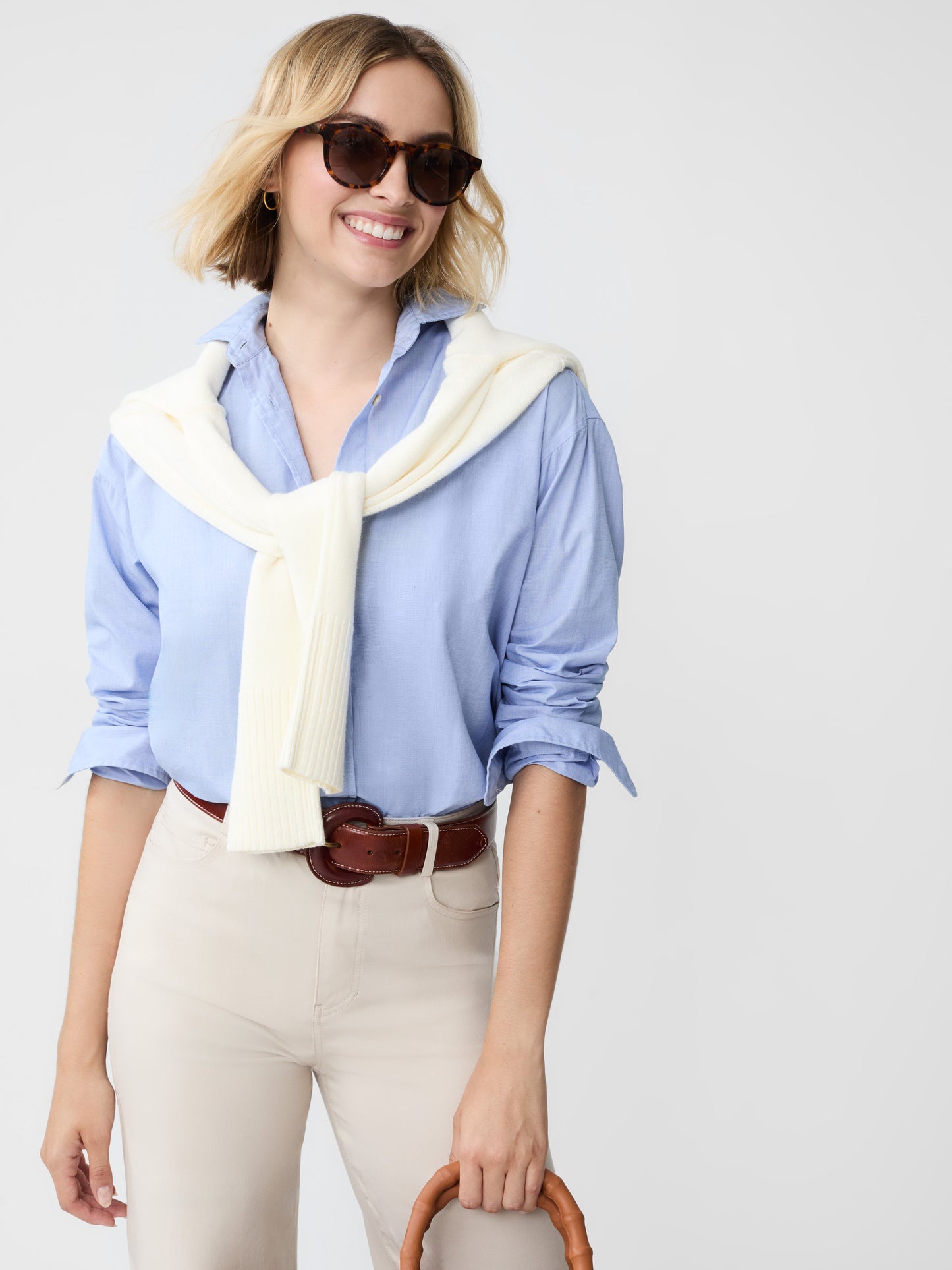 Model wearing J.McLaughlin Finn shirt in blue made with cotton.