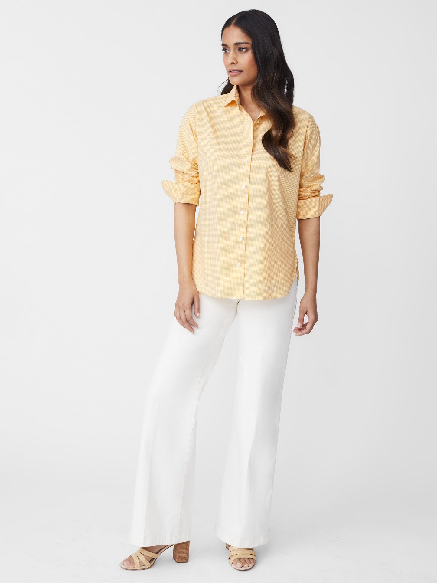 Model wears J.McLaughlin Finn shirt in golden/white made with cotton.