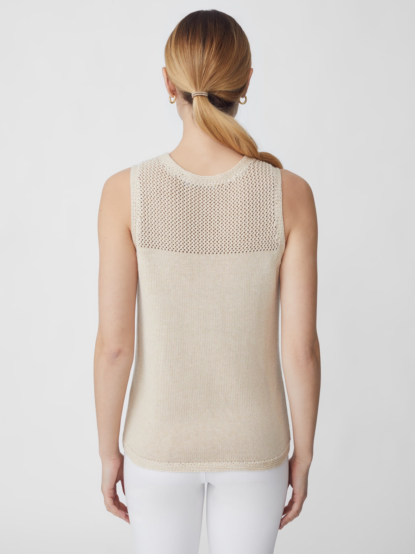 J.McLaughlin model wears Fripp Sleeveless Sweater in Heather Oatmeal made with Cotton and Modal.